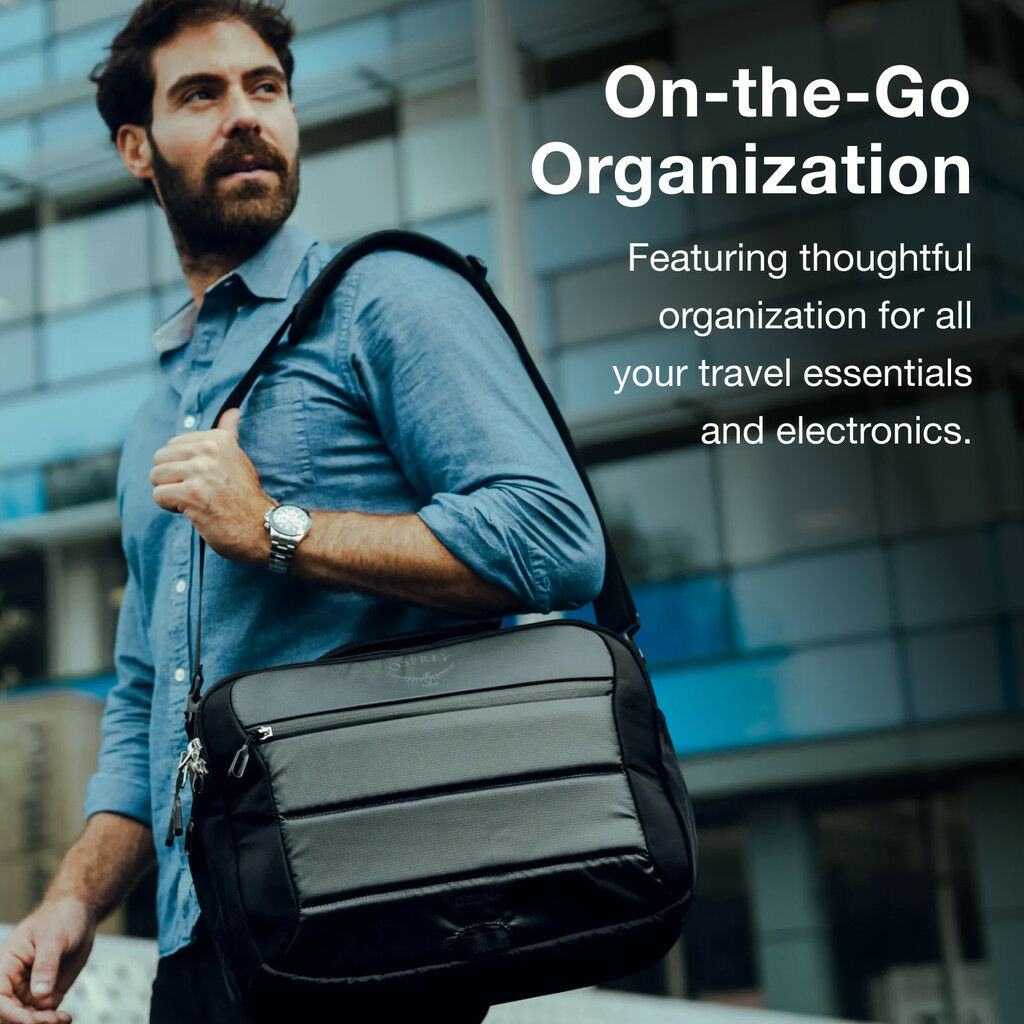Man carrying a black Osprey Ozone Brief Travel Bag with text about organization for travel essentials.