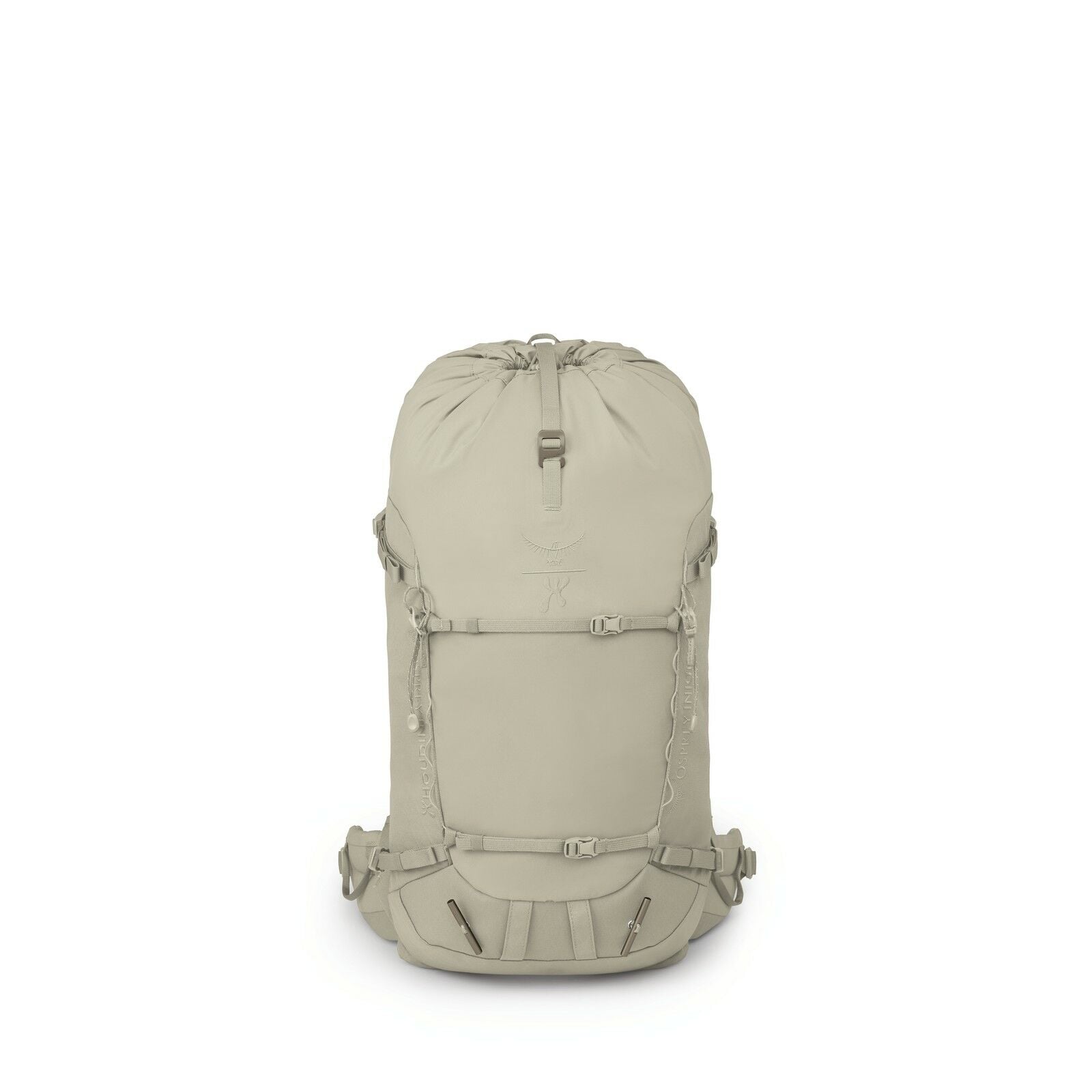 The image shows a light beige backpack with a minimalist and functional design. It features a drawstring closure at the top and a flap that likely secures with a clip. The front of the backpack has a series of loops for attaching gear, as well as two hori