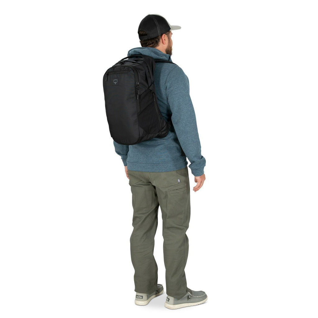 a person modeling the Aoede Airspeed Backpack  in color Black