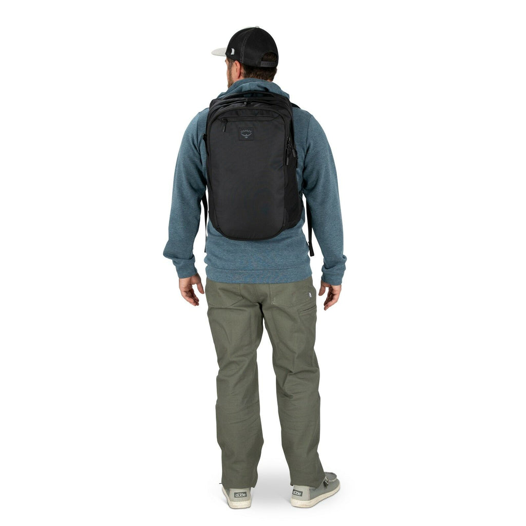 a person modeling the Aoede Airspeed Backpack  in color Black