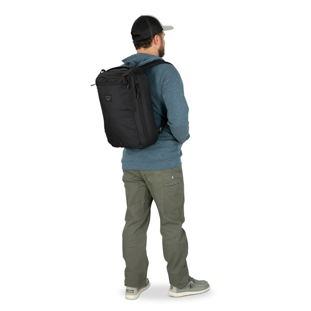 a person modeling the Aoede Briefpack  in color Black