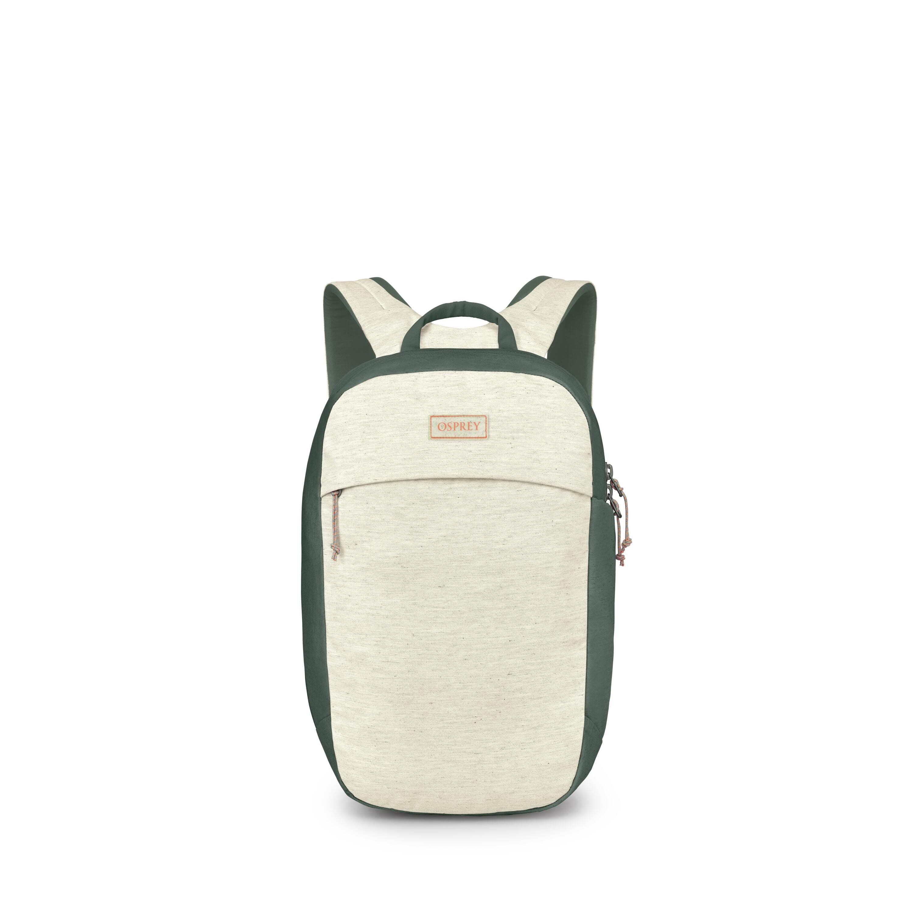A compact Osprey backpack is shown front-on in a clean product layout. The pack has a two-tone design with a light heathered cream front and dark green sides, straps, and trim. A small front zip pocket and a top grab handle are visible, along with the "OS