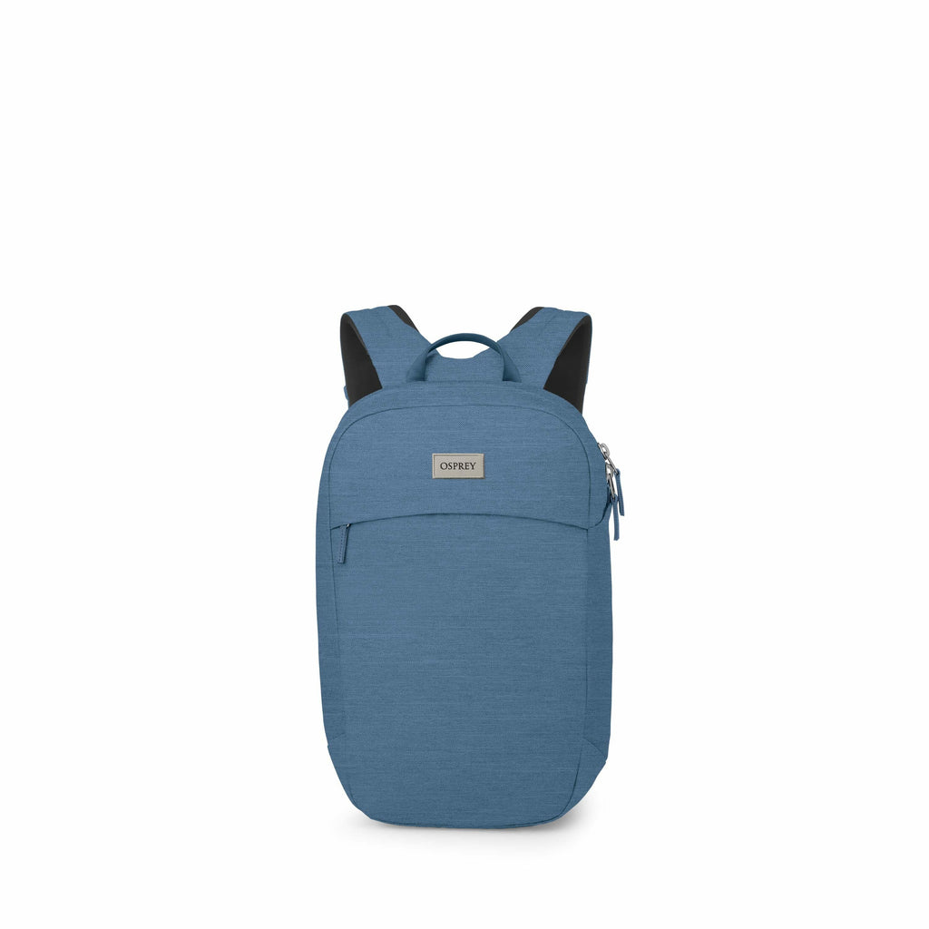 The image shows a blue Osprey backpack viewed from the front. The backpack features a simple and sleek design with a main compartment that has a zipper closure on the side. It has a small front pocket and a handle at the top for carrying. The shoulder str