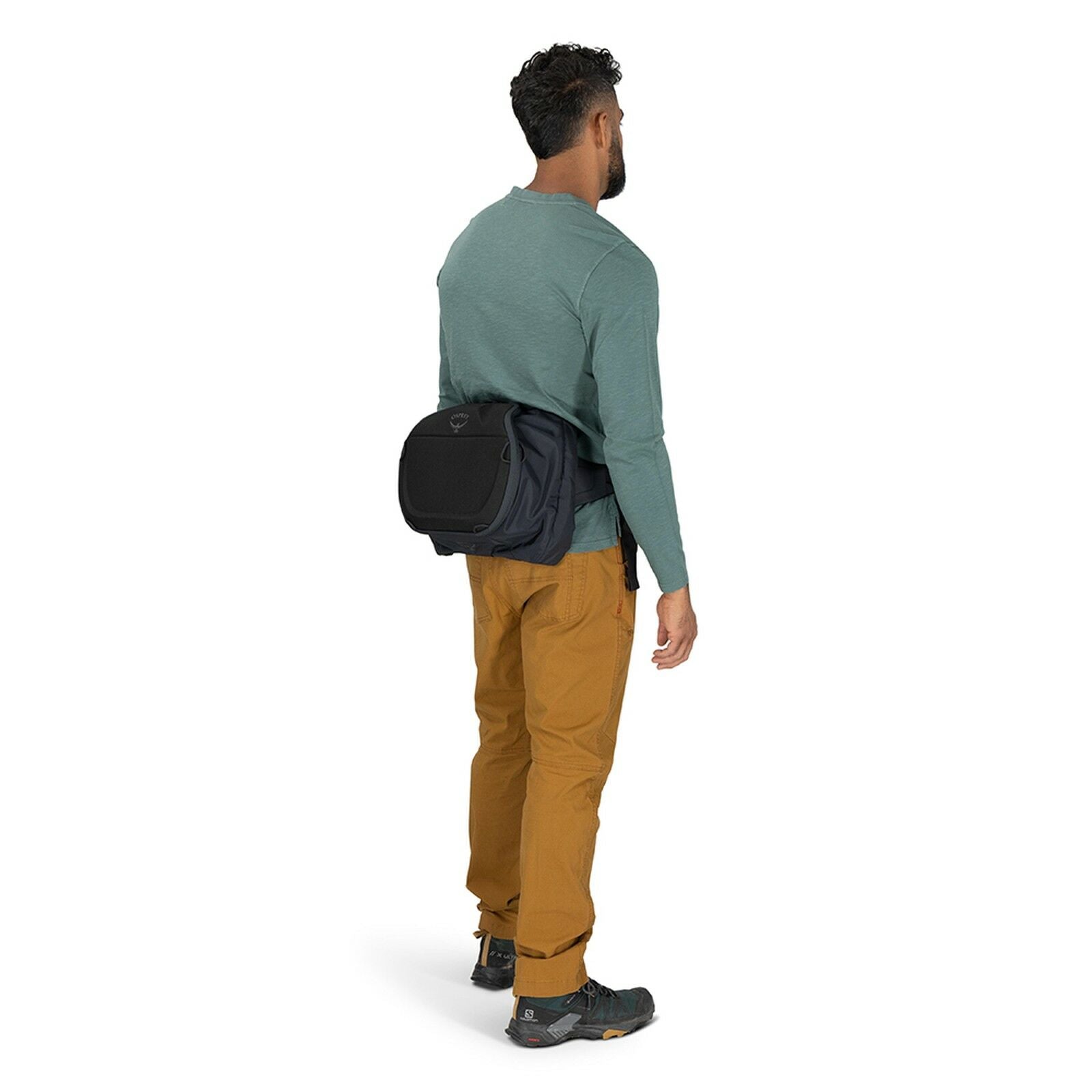 Side view of Osprey Photo Lid in the color Black worn on waist of model