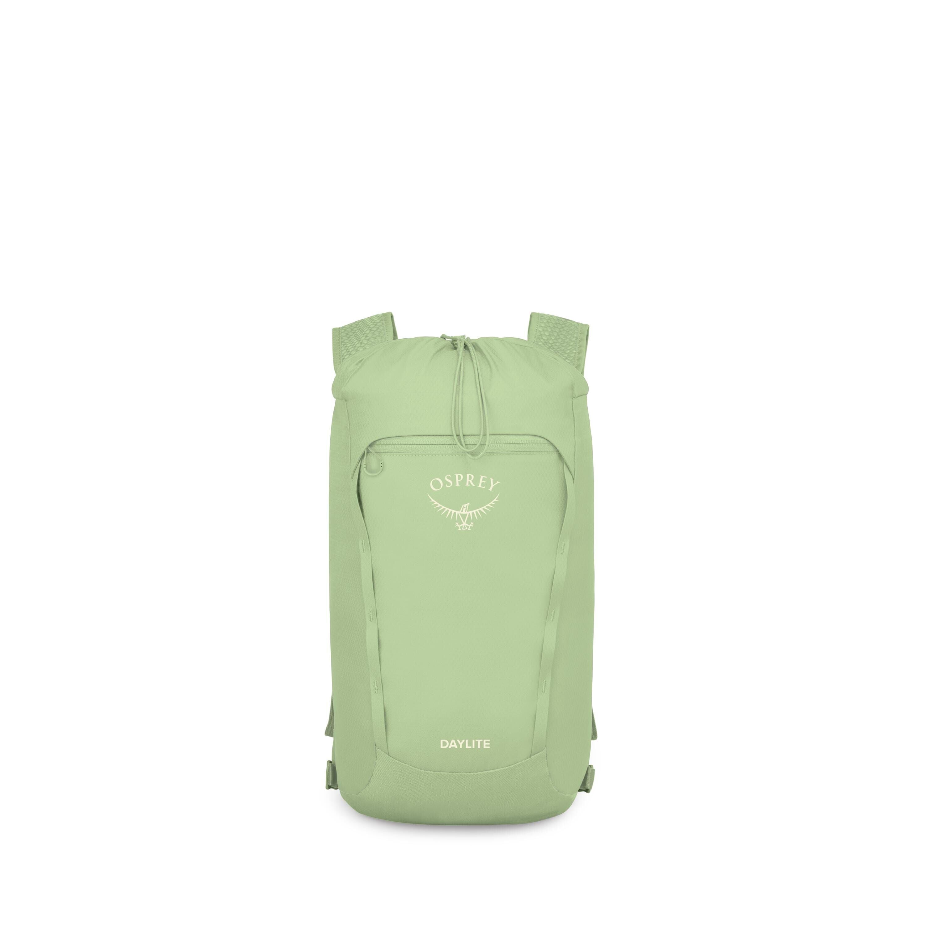 A compact Osprey Daylite backpack is shown against a white background. The bag is a light green color with a simple, streamlined design and a drawstring closure at the top. A front zip pocket features the Osprey logo and name in white, with "DAYLITE" prin