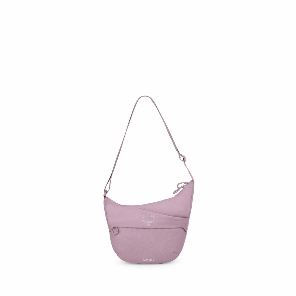 The image features a lavender-colored sling bag from the brand Osprey, specifically the Daylite model. The bag has a crescent shape with a wide zippered compartment at the top, designed for carrying personal items comfortably across the shoulder. The fron