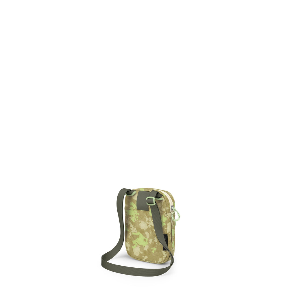 A small crossbody bag with a green digital-camouflage pattern is shown against a white background. It has a dark green adjustable shoulder strap with plastic buckles and a zipper pull in bright green. The bag is compact and rectangular with rounded corner