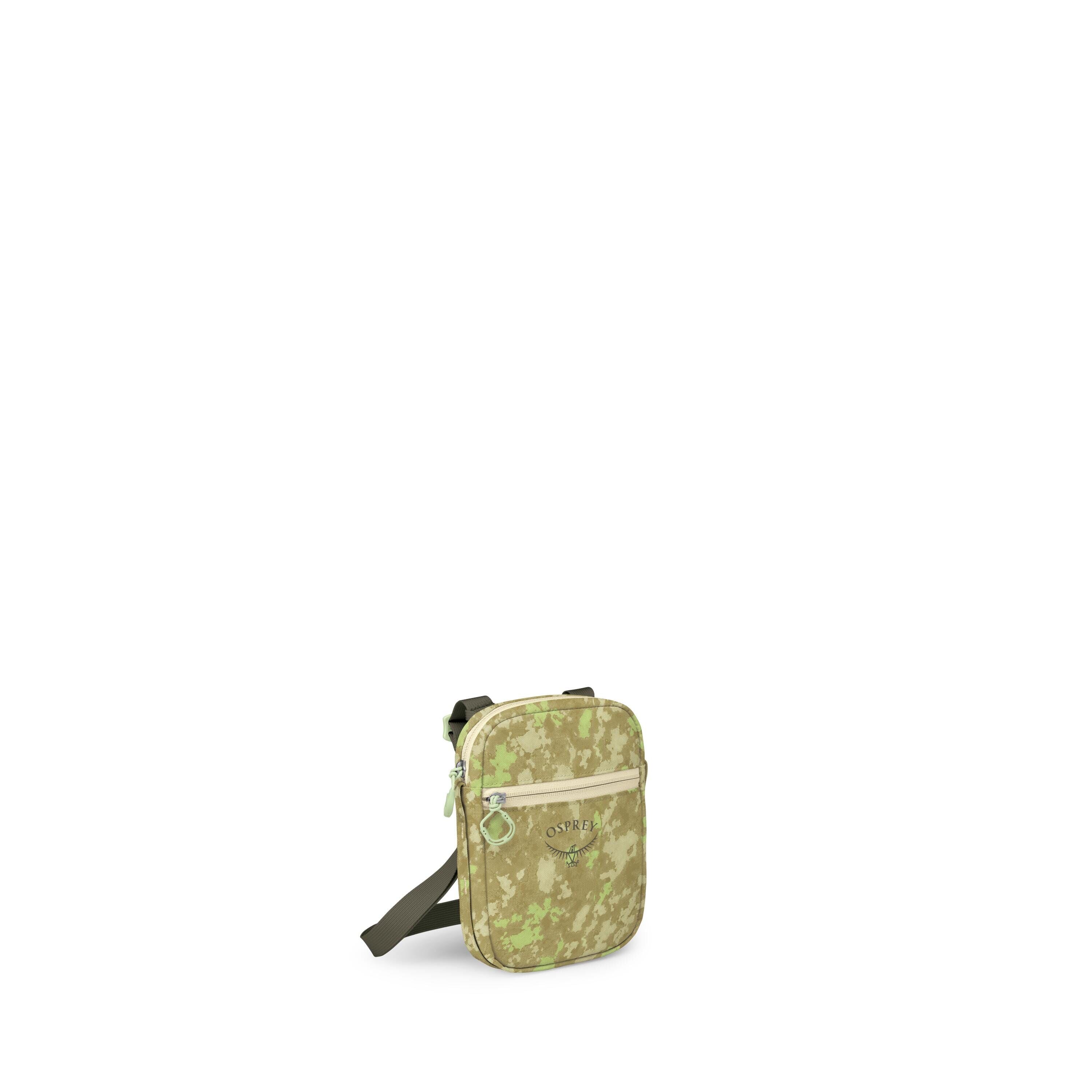 The images show a small crossbody sling bag with a green digital-camo pattern. It has a rounded rectangular shape, a front zip pocket with a light-beige zipper, and an Osprey logo printed on the front. An adjustable dark green strap is attached, and some