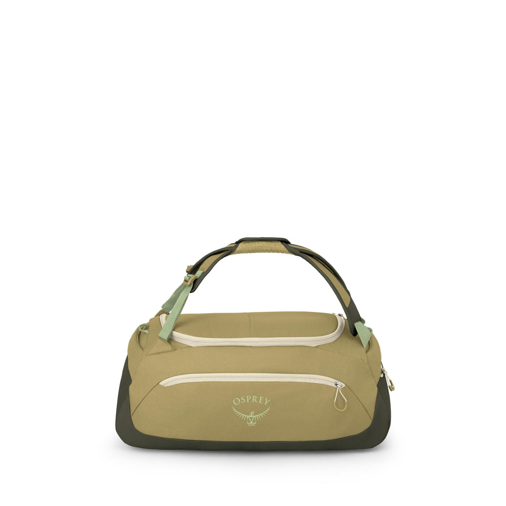 The image shows a compact Osprey duffel bag in shades of olive and green with cream zippers and accents. It has a padded, wraparound handle on top, a front zip pocket with the Osprey logo, and reinforced darker panels on the sides and base. Additional ima
