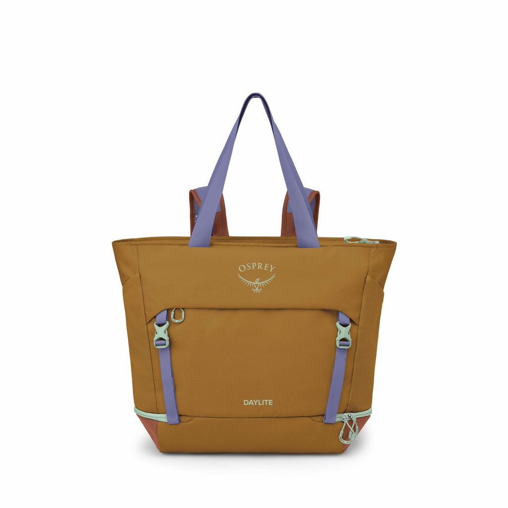 The image showcases a brown Osprey Daylite backpack featuring purple and teal accents. The backpack has a prominent Osprey logo printed at the top center, and "DAYLITE" text at the bottom center. It features adjustable straps, a spacious main compartment