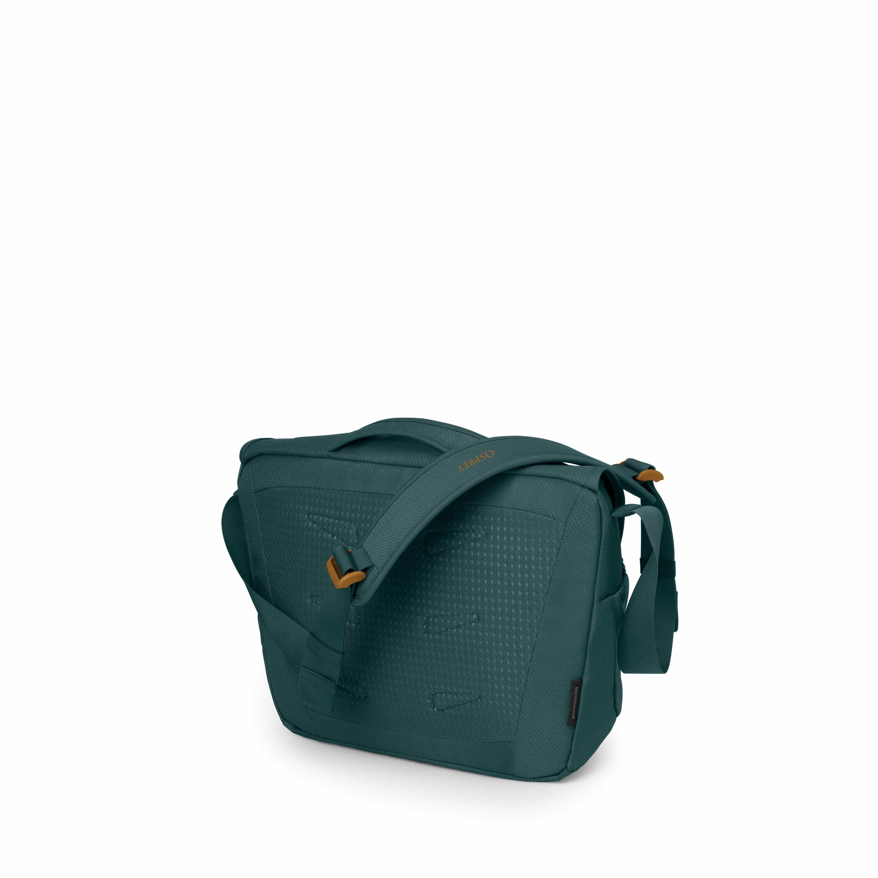The image features a stylish, deep teal colored shoulder bag with a textured pattern on its exterior. It has a broad, adjustable strap that is embellished with the logo "Soead" in a subtle, yet noticeable way. The bag's hardware, such as the strap adjuste