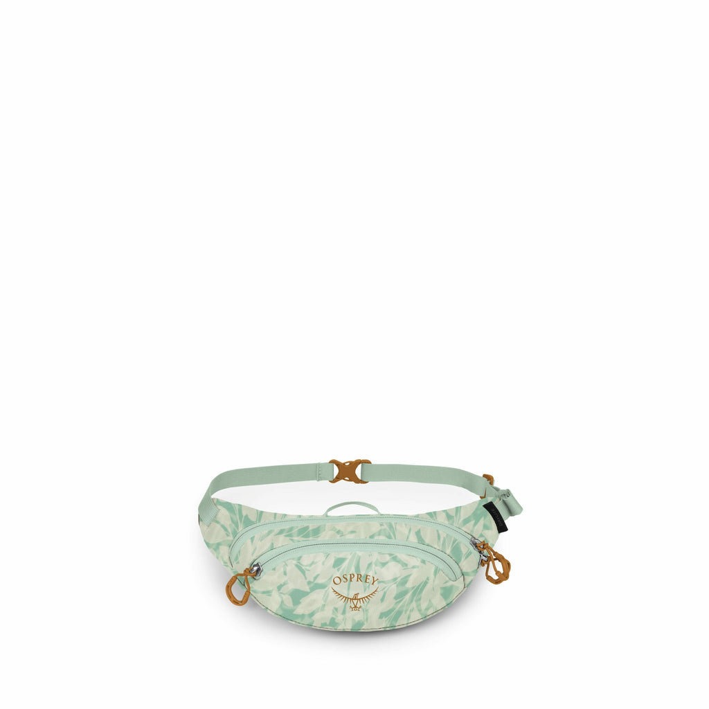 The image features a light green fanny pack with a subtle leaf pattern printed across the fabric. The pack is produced by Osprey, as indicated by the logo prominently displayed on the front, along with an image of an osprey bird. The fanny pack has a cent