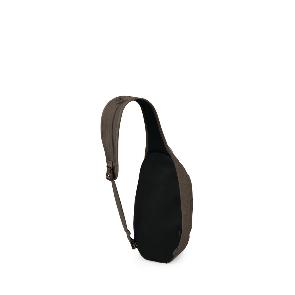 The image shows a compact sling bag photographed from a side-rear angle. It has a single padded shoulder strap with an adjustable buckle and a teardrop-shaped body. The back panel appears black and breathable, while the outer fabric is an olive or dark kh