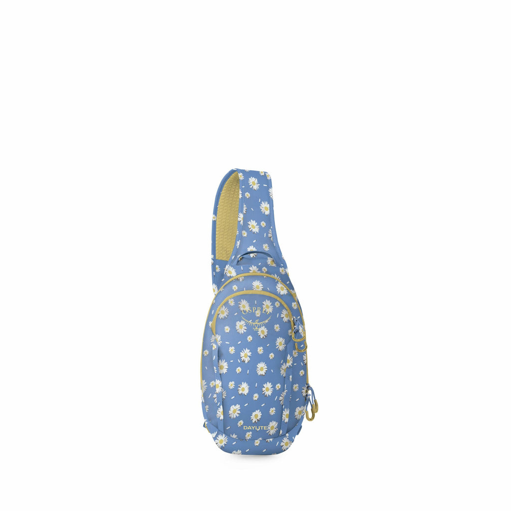 The image features a light blue sling bag with a daisy floral pattern. The bag has a single strap for wearing across the body. It appears to have multiple compartments, as indicated by the zippers. The strap and some edges of the bag are lined with a cont