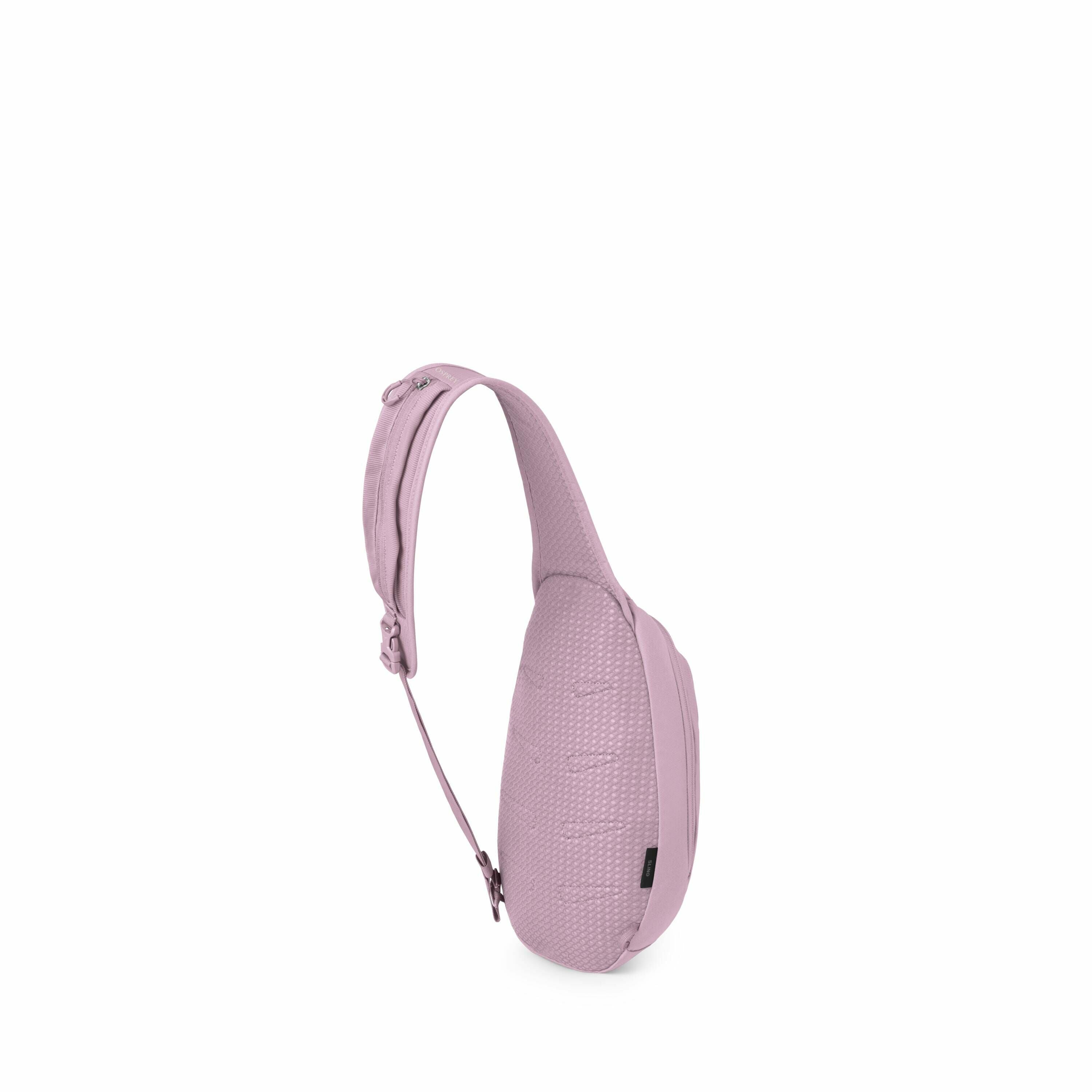The image displays a sleek, minimalist sling bag in a soft purple color, viewed from a three-quarter angle. It features a textured surface on the front, with an adjustable shoulder strap for comfortable wear. The sling bag has a zipper closure and a small