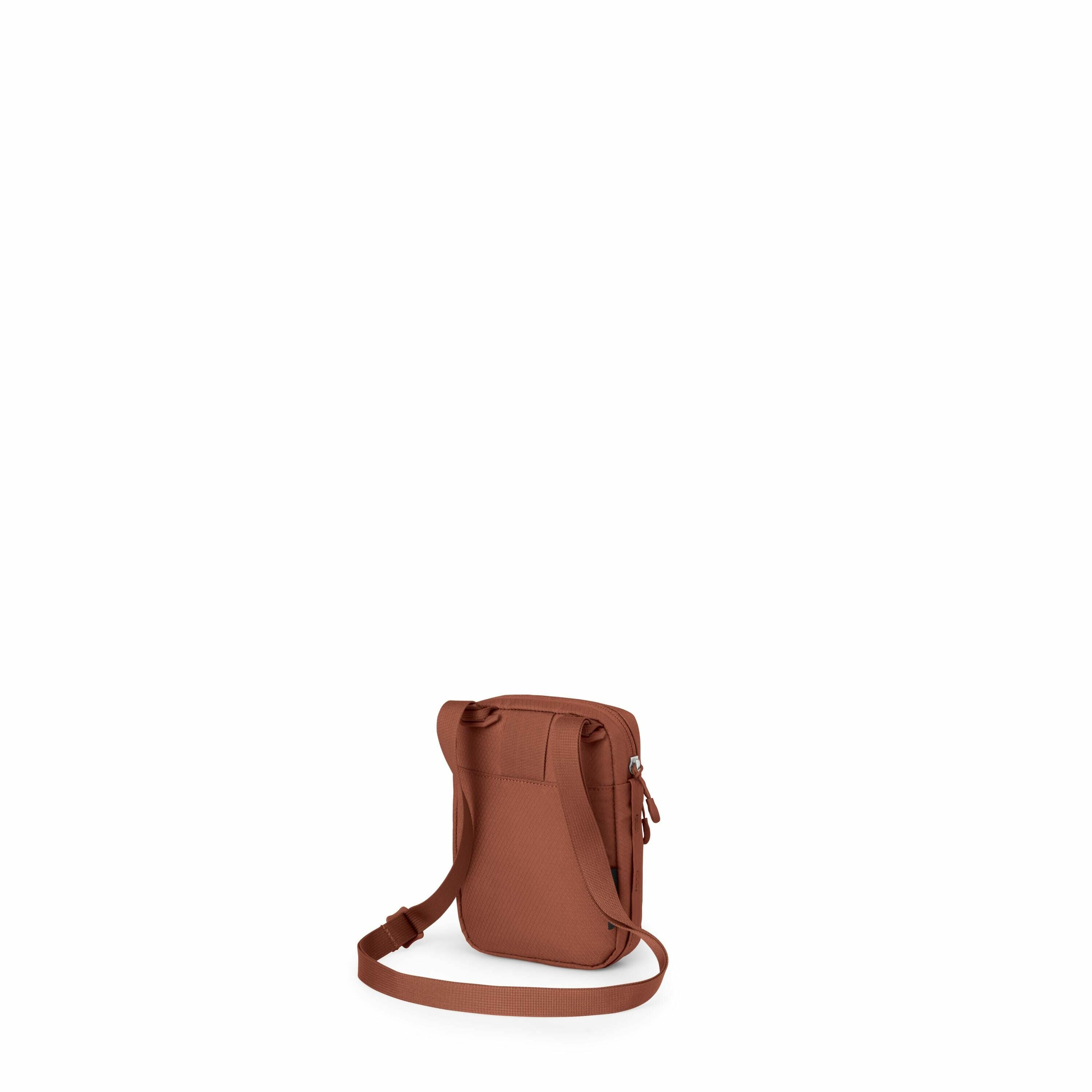 The image depicts a small, rectangular shoulder bag in a terracotta shade. It features an adjustable strap and is designed with a simplistic, practical aesthetic. The back of the bag shows a small pocket for easy access to items, along with a sturdy zippe