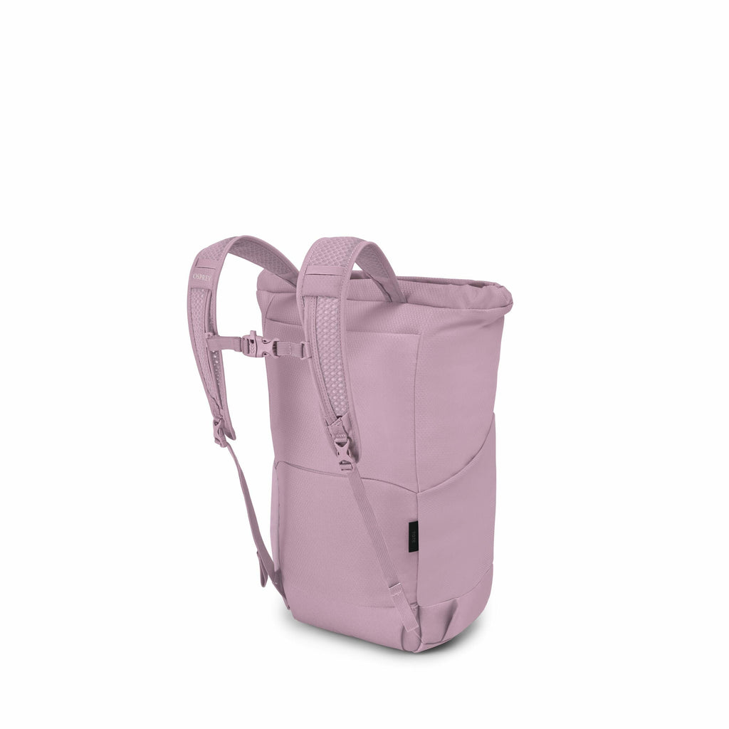 The image showcases a light purple backpack with a modern design, featuring padded straps and a sleek, curved shape. The backpack has a roll-top closure, providing a minimalist and streamlined look. It includes adjustable shoulder straps with a front ches