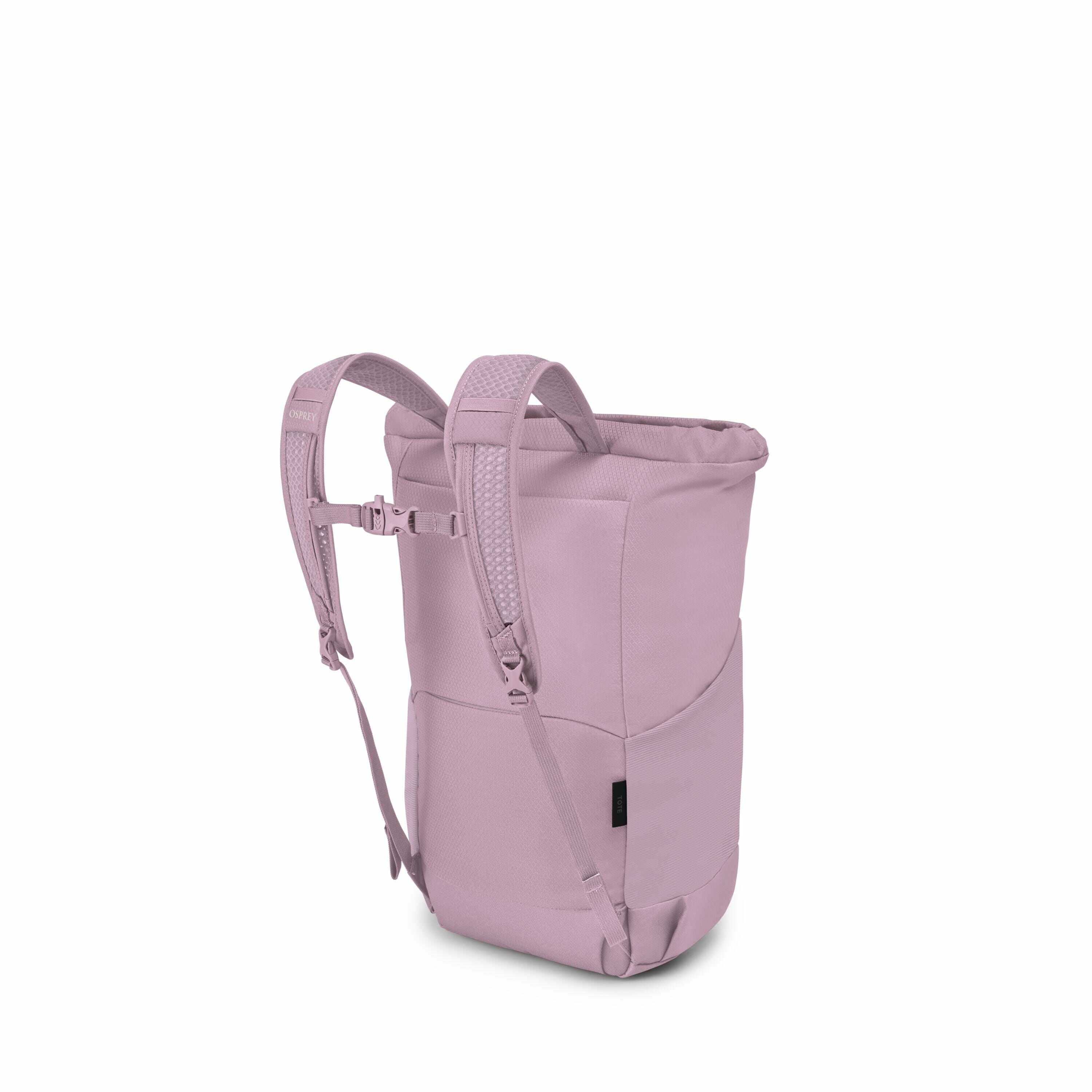 The image showcases a light purple backpack with a modern design, featuring padded straps and a sleek, curved shape. The backpack has a roll-top closure, providing a minimalist and streamlined look. It includes adjustable shoulder straps with a front ches