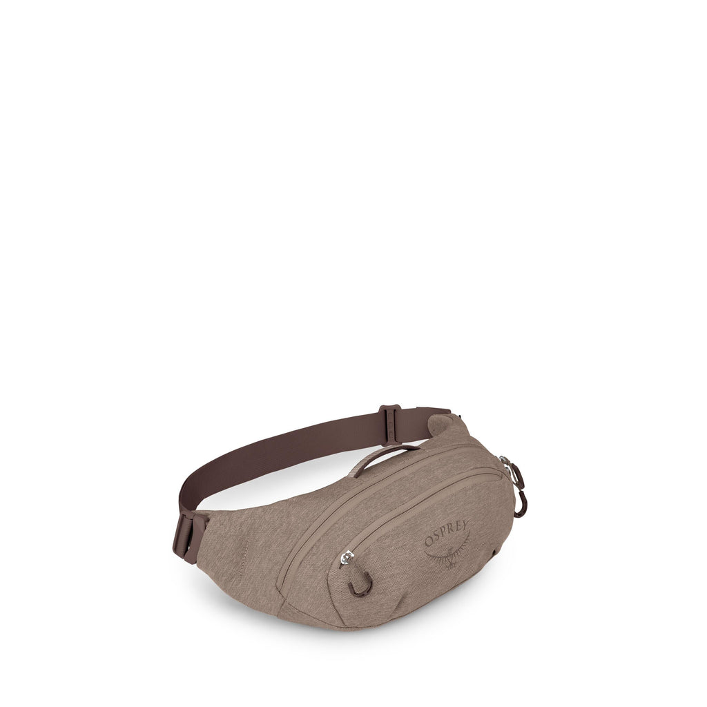 A compact beige waist pack with brown accents is shown from multiple angles, highlighting its features. The front has two zippered compartments with pulls and subtle Osprey branding. An adjustable brown strap with a buckle wraps around the back, and small