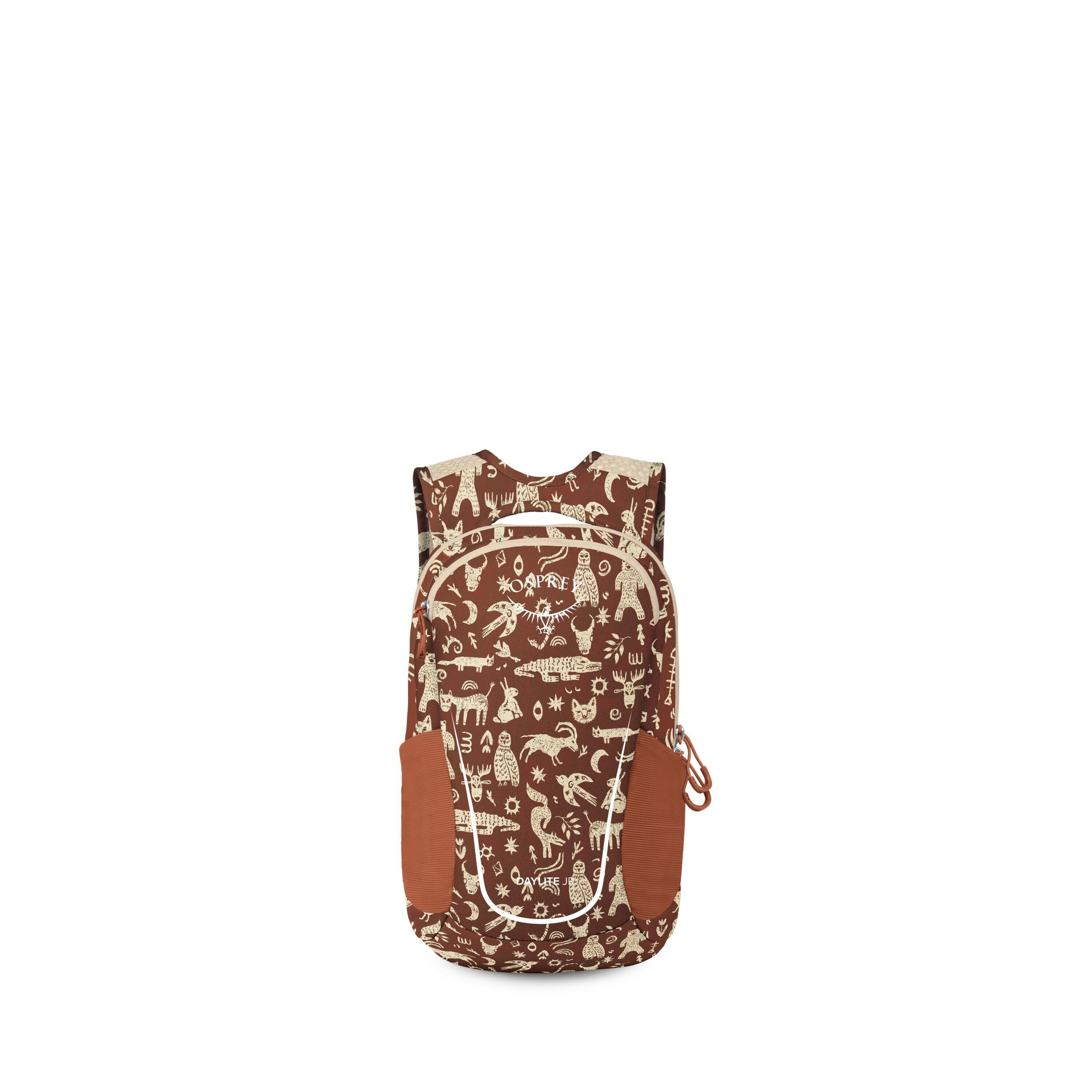 A small brown backpack with cream-colored tribal animal and nature doodles is shown against a white background. It features a front zip pocket outlined in light trim and two rust-colored side pockets. The bag has a top handle and shoulder straps, with a t