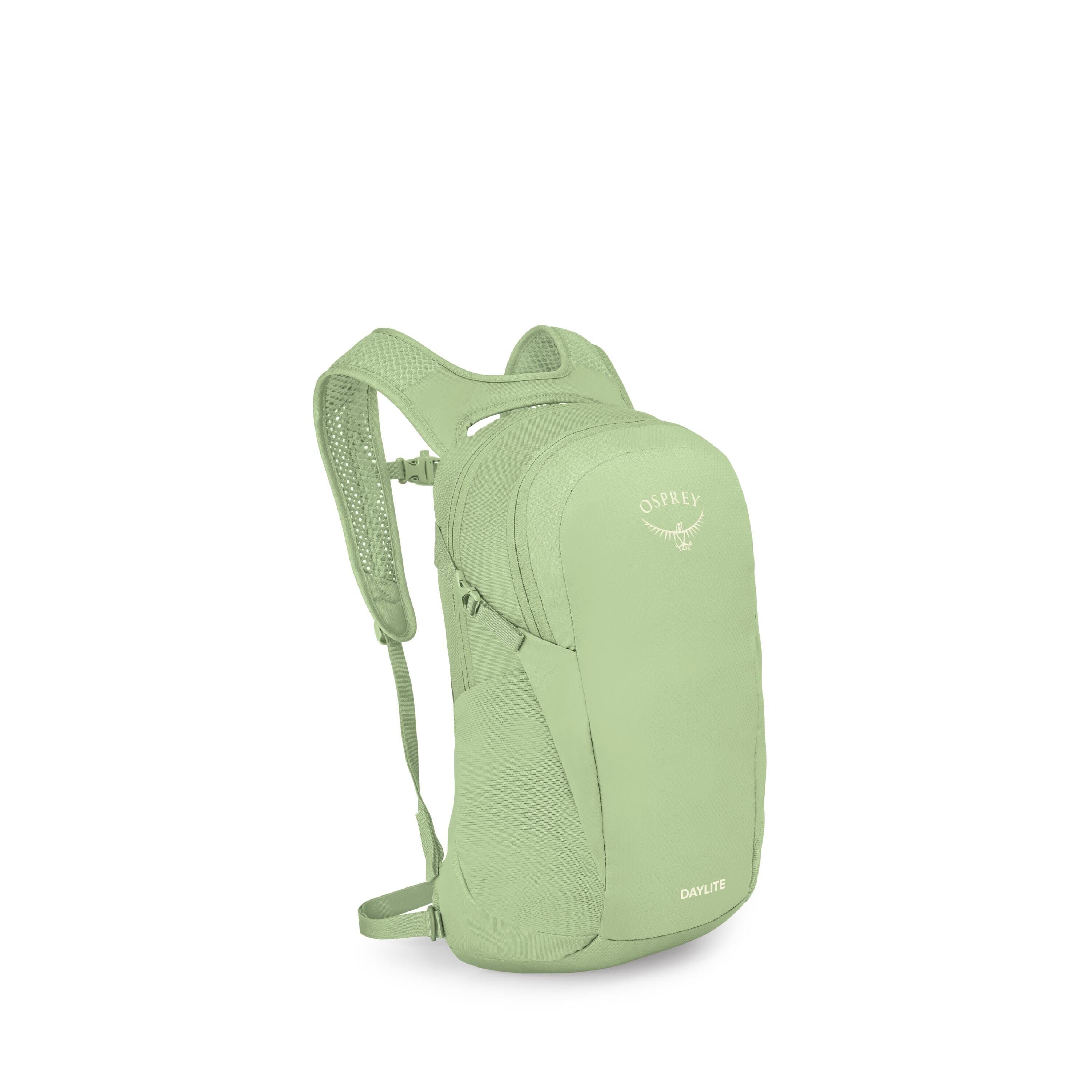 The image shows a light green Osprey Daylite backpack standing at a slight angle. It has a streamlined main compartment with a front panel, side stretch pocket, and a small zip pocket near the top. The shoulder straps and back panel are ventilated with me