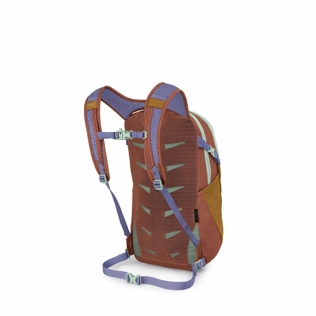 The image shows a colorful backpack designed for outdoor activities. It features a combination of earth tones, including brown, green, and a touch of lavender for the straps and buckles. The backpack has adjustable shoulder straps, a chest strap, and a wa
