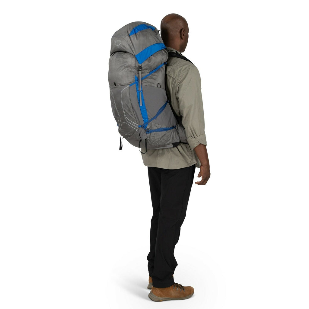 a person modeling the Exos Pro 55 in color dalegreyagamblue