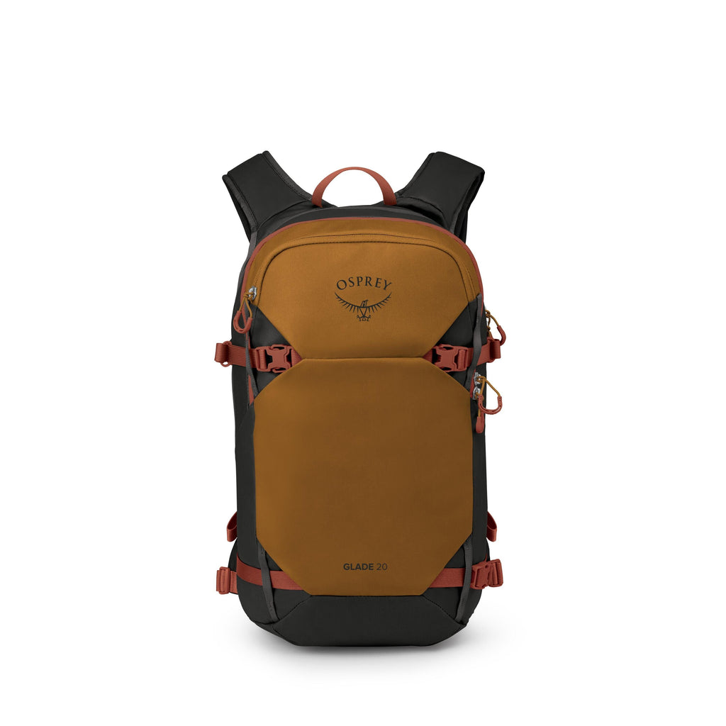 A compact outdoor backpack is shown from the front, branded with the Osprey logo and labeled "GLADE 20." The pack is primarily a mustard-brown color with black panels and red accents on the zippers, straps, and handle. It features multiple compression str