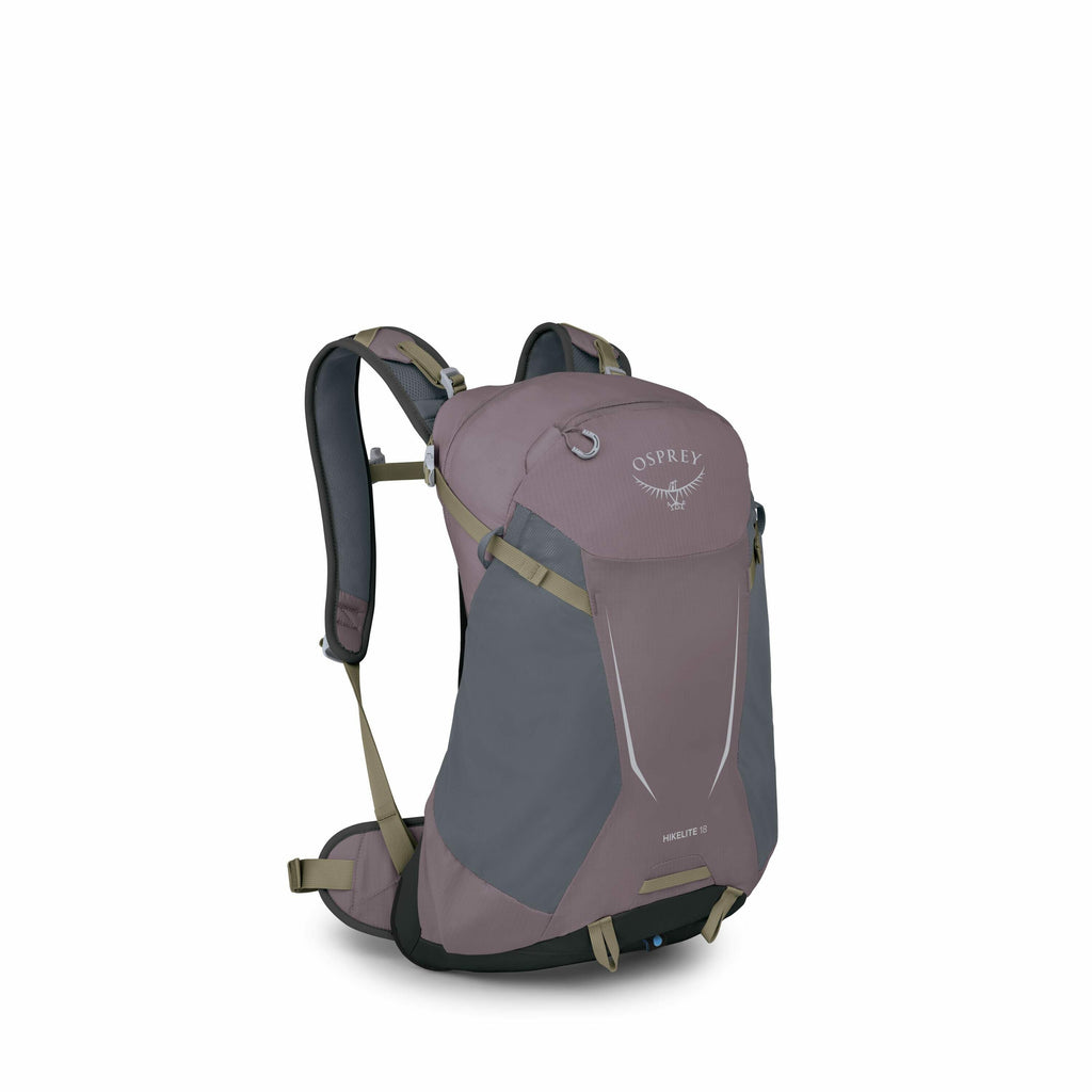 The image depicts a purple and gray Osprey hiking backpack, specifically the Hikelite 18 model. The backpack features an ergonomic design with padded shoulder straps and a hip belt for comfortable weight distribution. There are various attachment points a