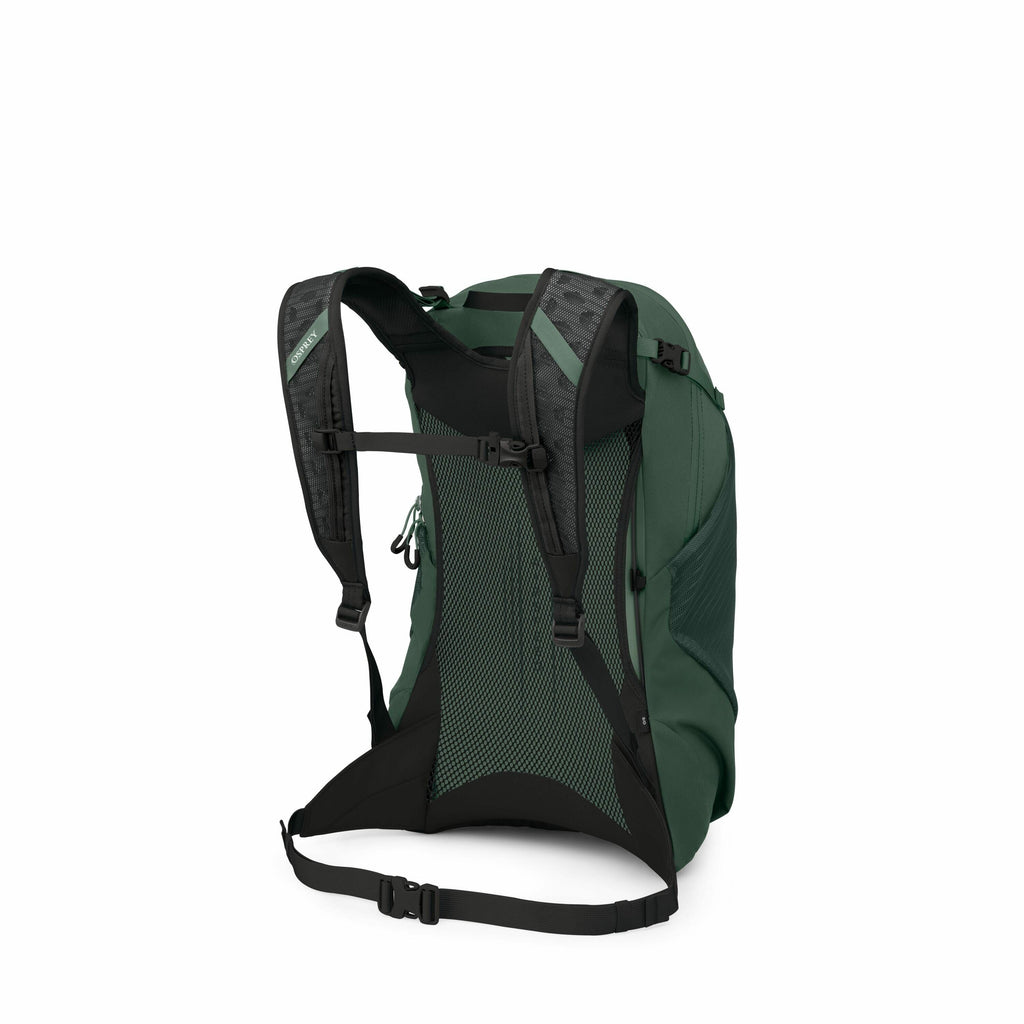 The image depicts a dark green Osprey backpack, viewed from the back, showcasing its adjustable shoulder straps and hip belt. The shoulder straps are black with a textured pattern, and one of them features the Osprey logo in green. The back panel of the b