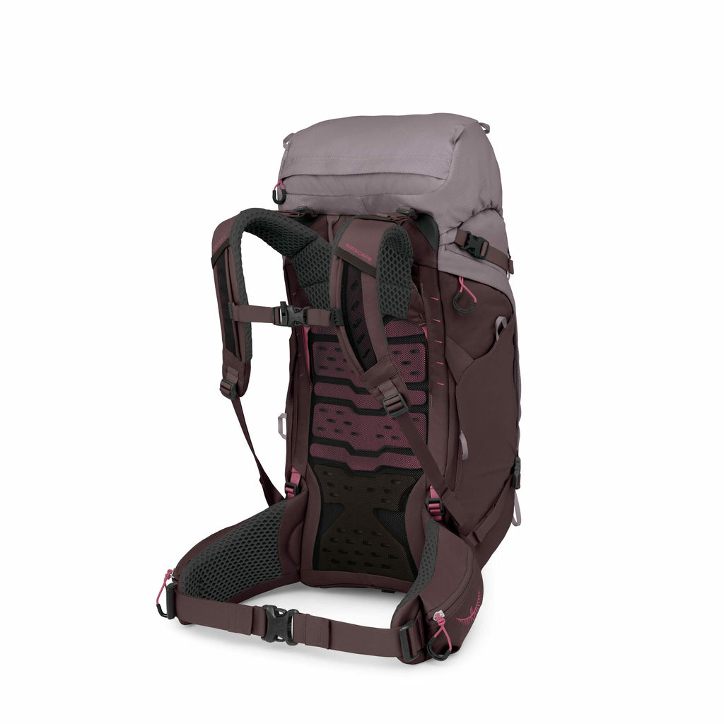 The images depict a deconstructed view of a hiking backpack, showing various components and their arrangement. The main structure includes a deep purple and light gray body with ergonomic padded shoulder straps and a waist belt for support. The backpack f