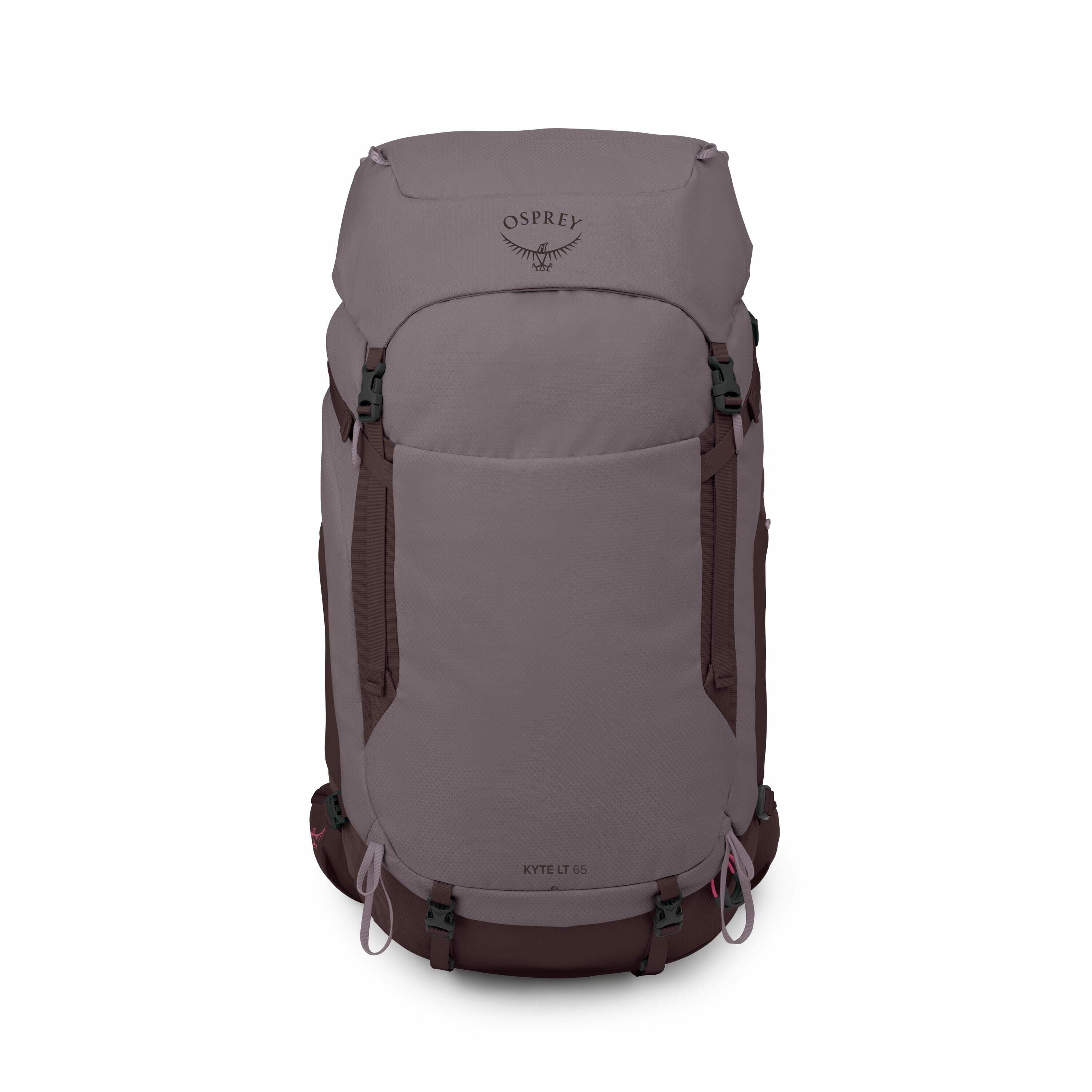 The image features an Osprey Kyte LT 65 backpack in a muted purple-gray color with darker brown accents. It has a sleek, cylindrical design with a top lid and multiple attachment points for gear. The Osprey logo, which resembles an outstretched bird, is p