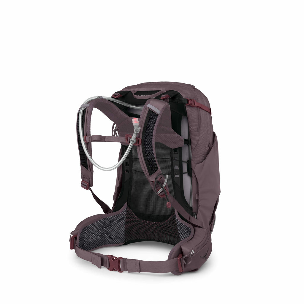 The image shows a sophisticated hiking backpack designed by Osprey, a well-known outdoor gear manufacturer. The backpack features a mesh back panel for ventilation, padded shoulder straps, and a wide hip belt for better weight distribution and comfort dur