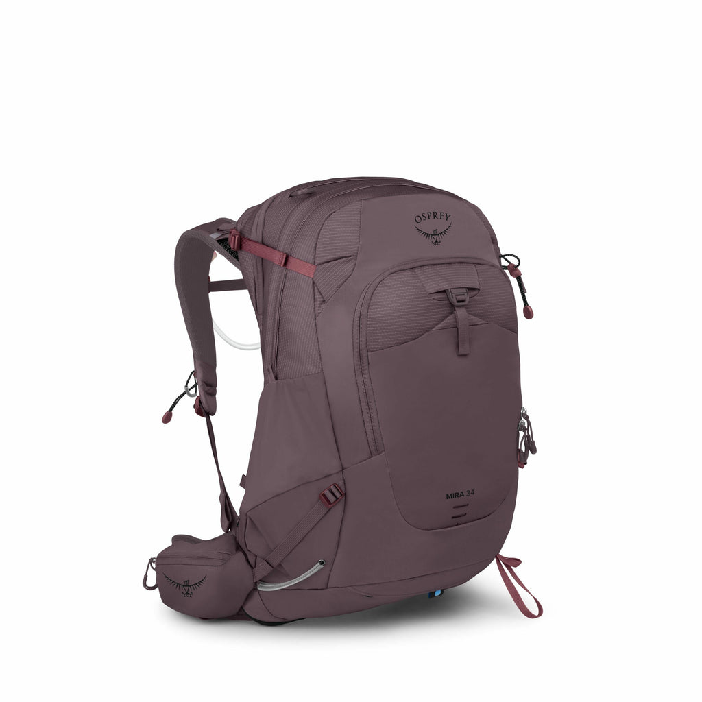The image features an Osprey Mira 34 backpack designed for hiking or outdoor activities. It is predominantly plum-colored with several compartments and adjustable straps for securing the contents and ensuring comfort when worn. The backpack is equipped wi
