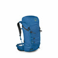 The image depicts a blue Osprey backpack designed for hiking or outdoor adventures. It has a tall and streamlined profile with multiple compartments and straps visible on its exterior for securing items. The backpack features mesh pockets on the sides for