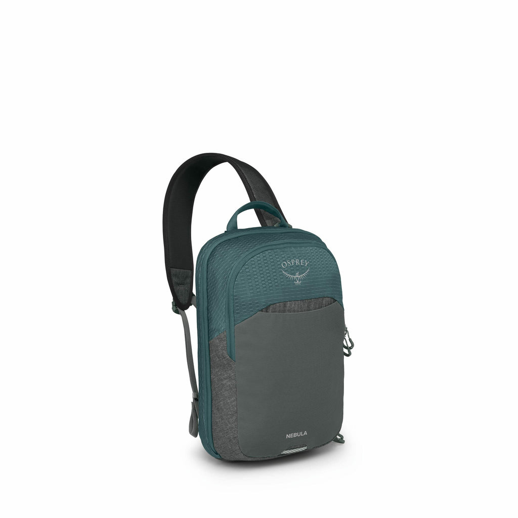 The image features a teal and gray Osprey backpack, specifically the Nebula model. The backpack has a sleek design with a large main compartment and a front pocket with a zipper, accented by different textures and shades of fabric. The shoulder straps are