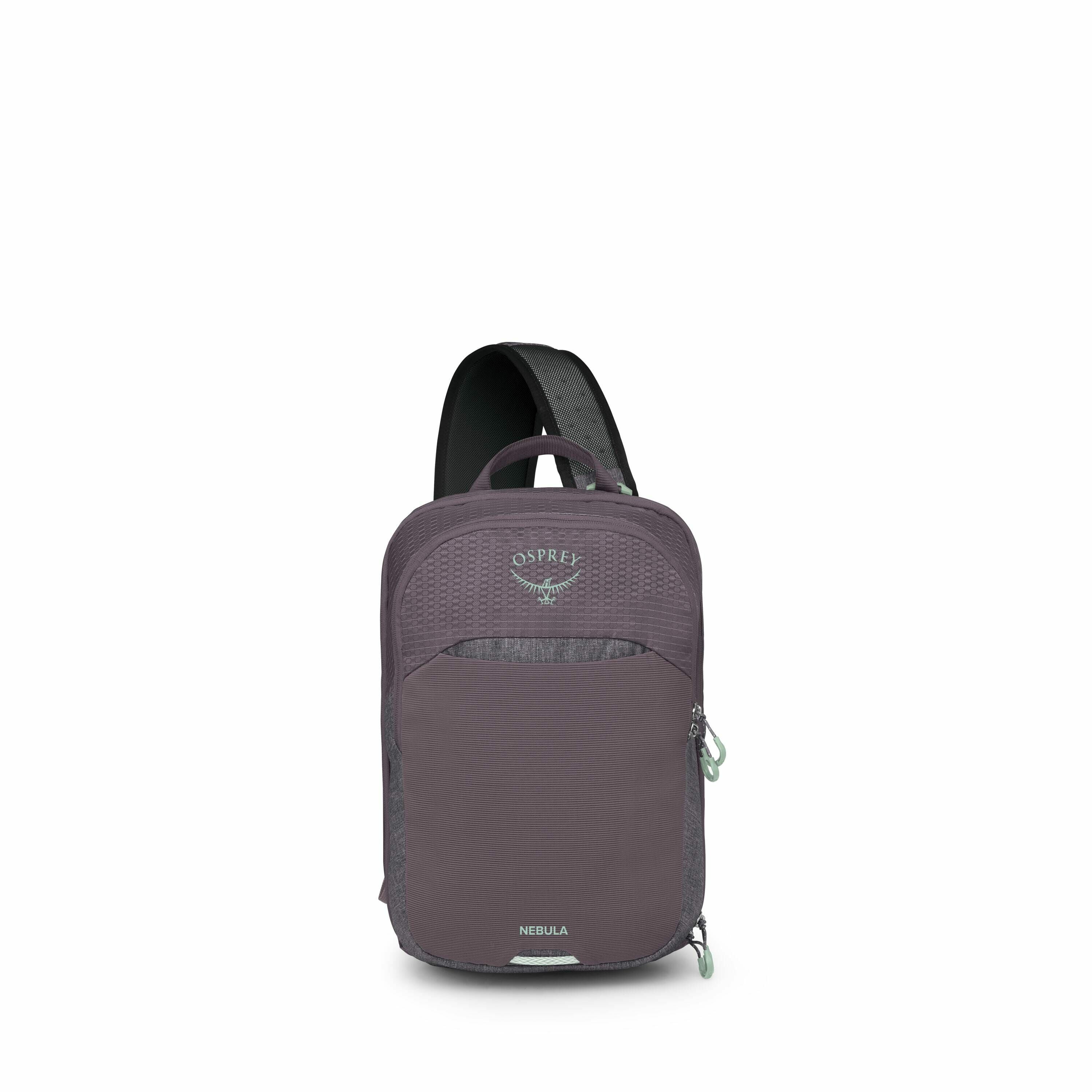 The image features a purple Osprey Nebula backpack with a sleek and compact design. It has a single shoulder strap, indicating that it is a sling-style backpack. The front of the backpack displays the Osprey logo and brand name prominently. The zippers an