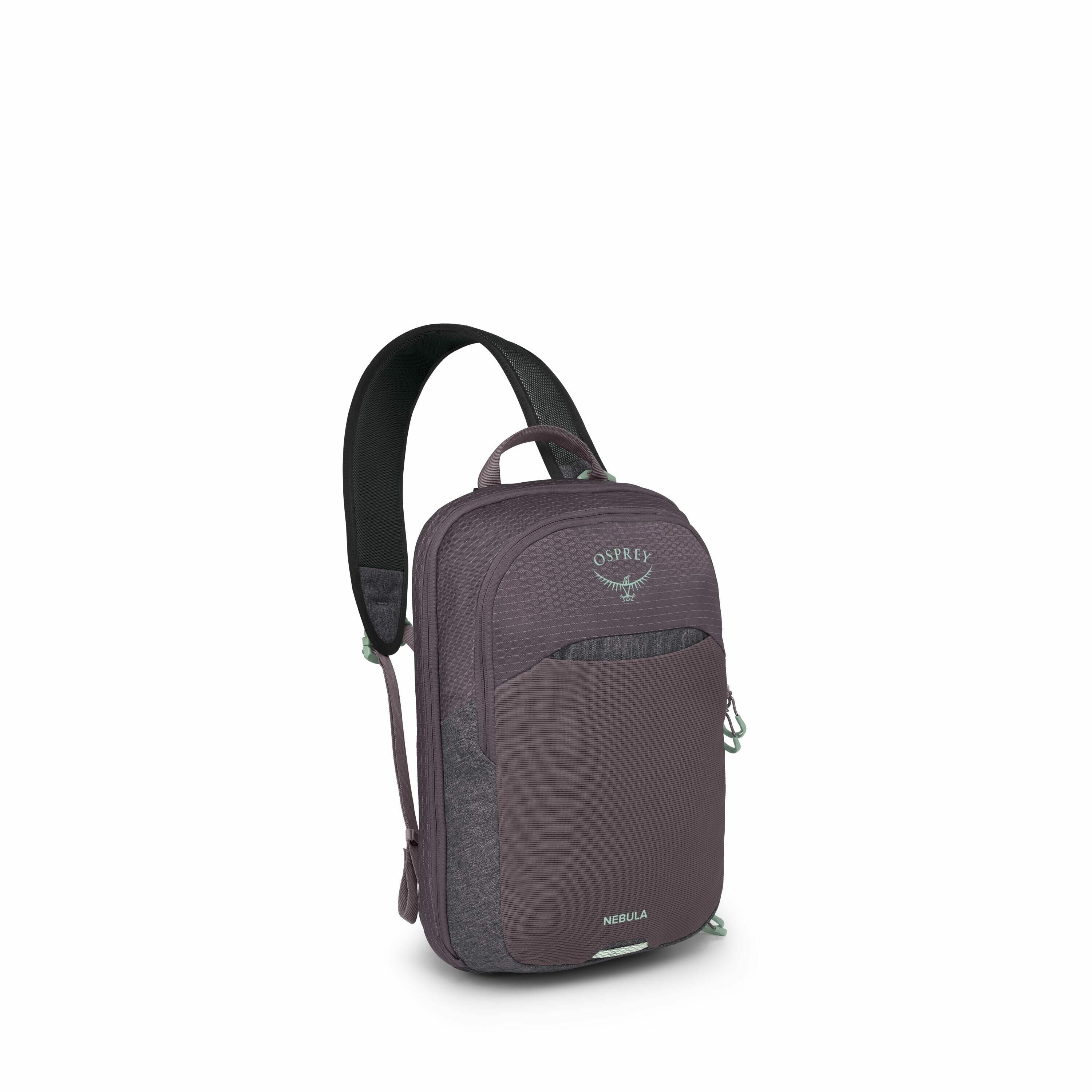 The image shows an Osprey Nebula backpack in a deep purple color. The backpack features a sleek design with a top handle, a front zippered pocket, and the brand's logo embroidered near the top. It is equipped with padded shoulder straps for comfort and in