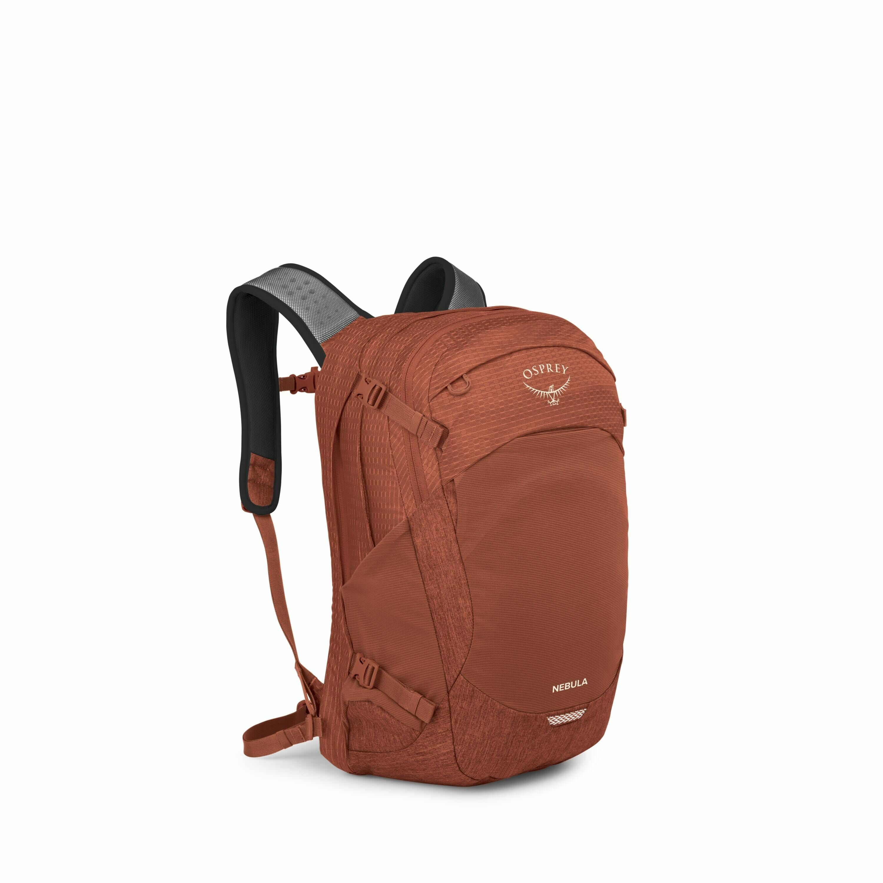 The image displays a rust-colored Osprey Nebula backpack. The backpack has a sleek and functional design, featuring a large main compartment with a zippered closure and additional pockets on the front for organization. The brand's logo, a stylized bird, i