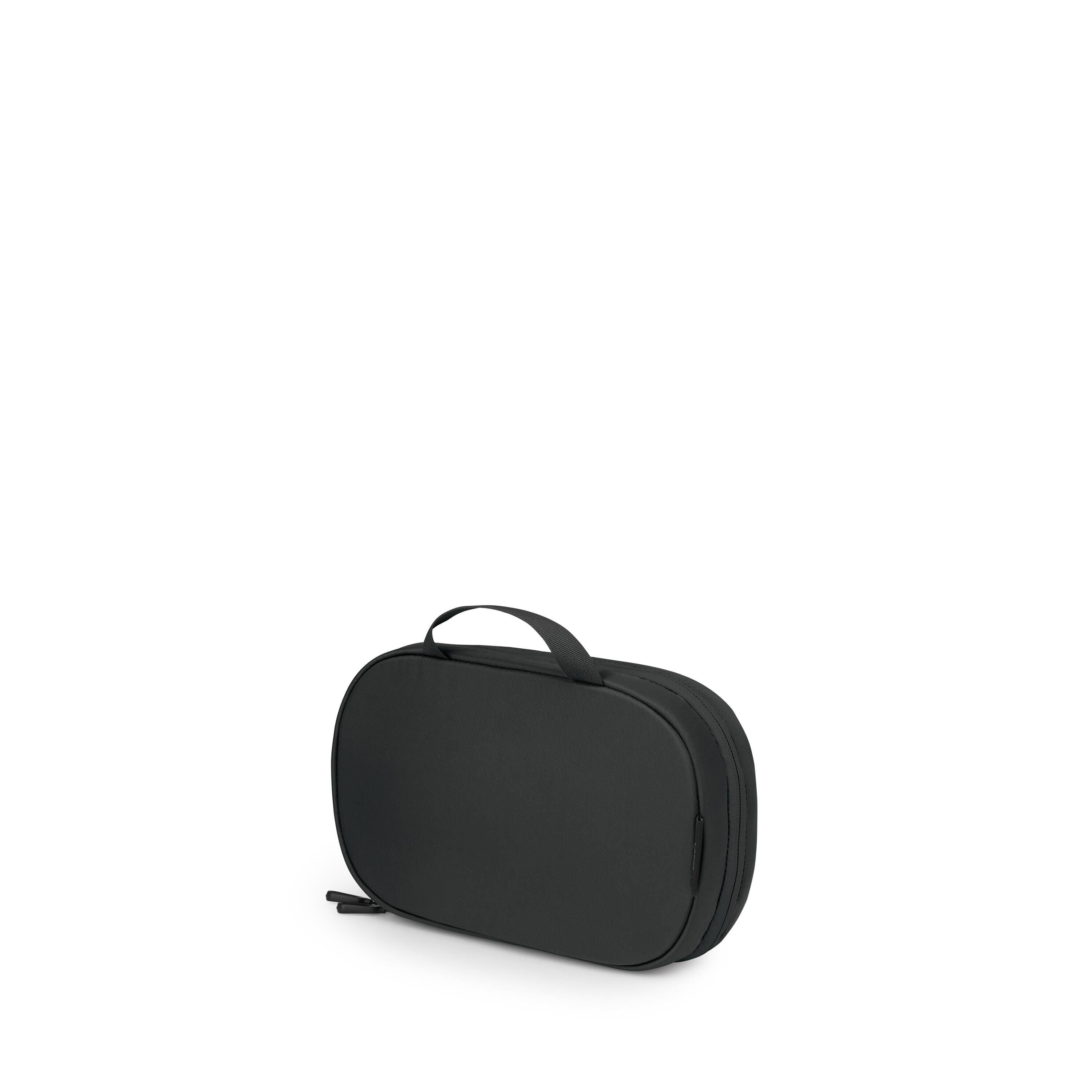 A compact black travel case with an oval, rounded-rectangle shape is shown against a white background. It has a short carrying handle on top and dual zipper pulls along the edge. The bag appears semi-rigid with clean, minimalist styling. One image angle a