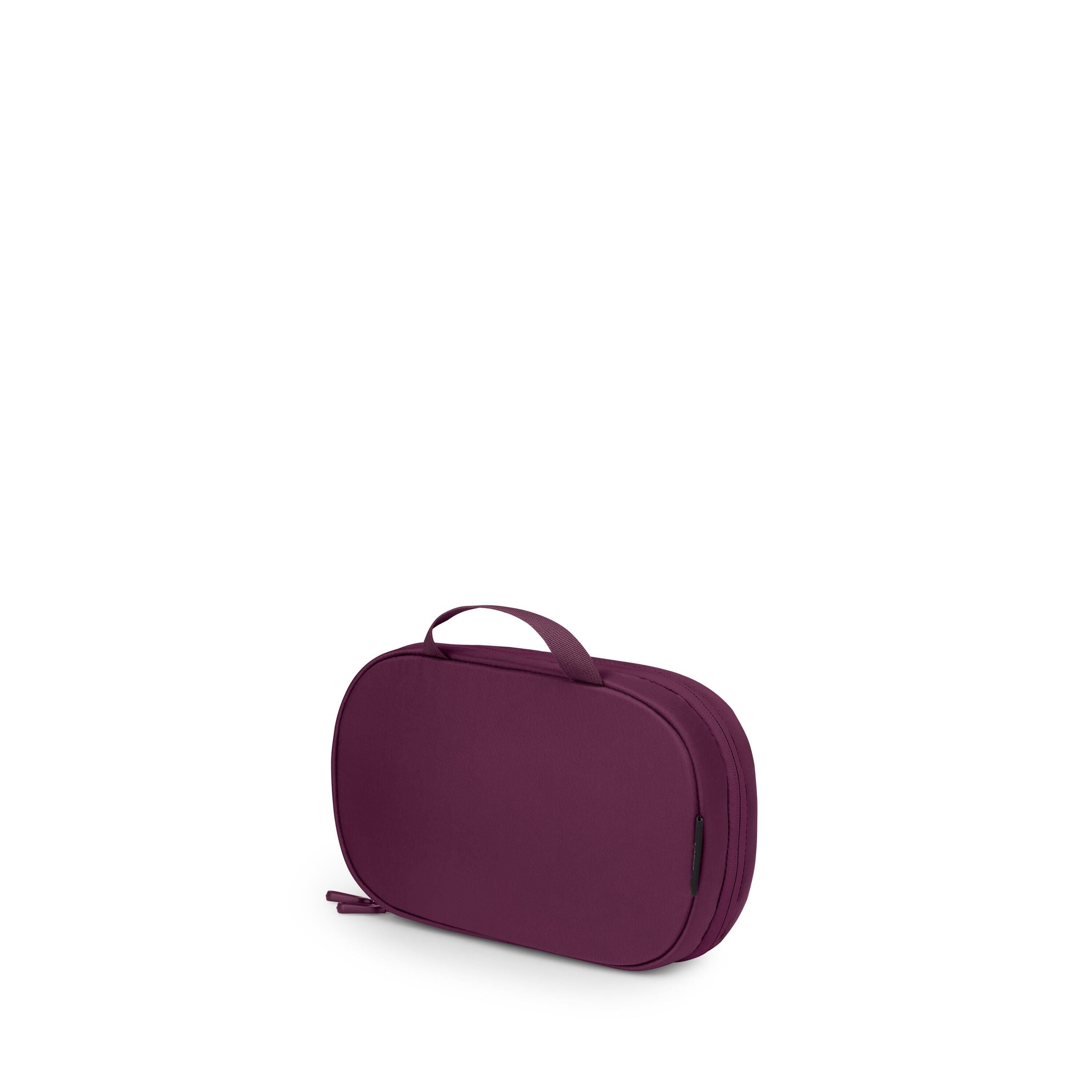 A compact, oval-shaped travel pouch in a rich purple color is shown against a white background. It has a small top handle and a zipper that runs around the edge for easy opening. The fabric appears smooth and slightly structured, suggesting it's padded or