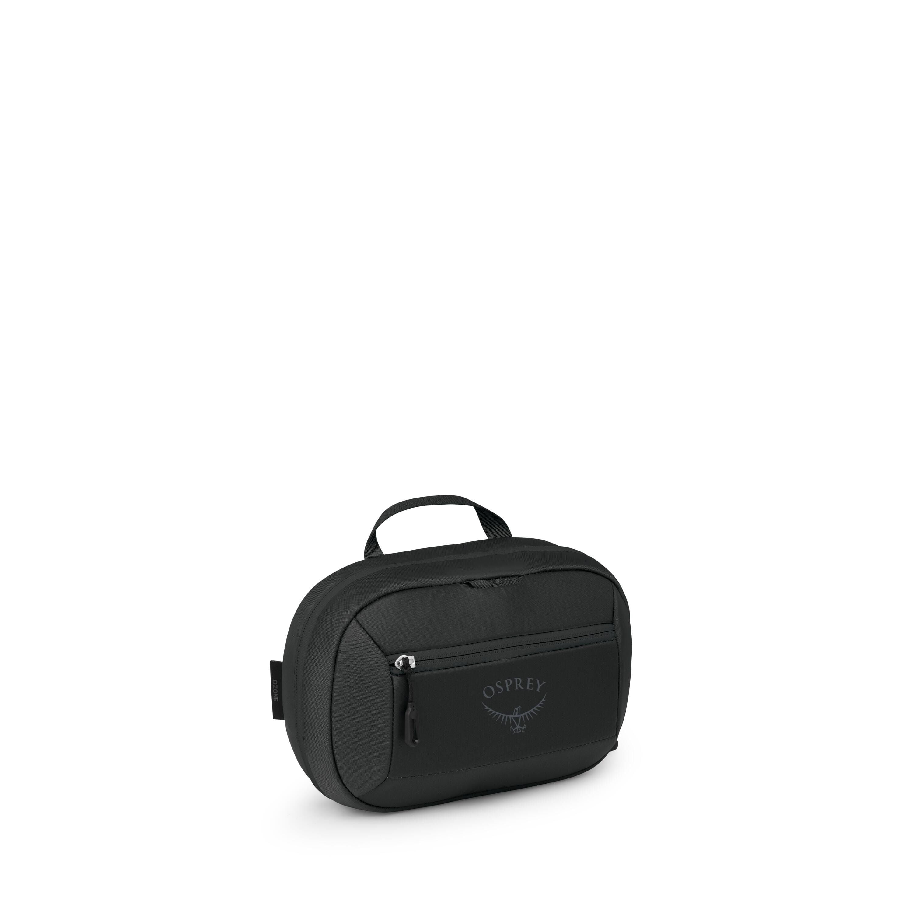 The images show a compact black Osprey travel pouch or toiletry bag. It has an oval shape with a small top handle, a front zip pocket with the Osprey logo, and a main zip compartment. Additional frames highlight reflective or white zipper details and clos