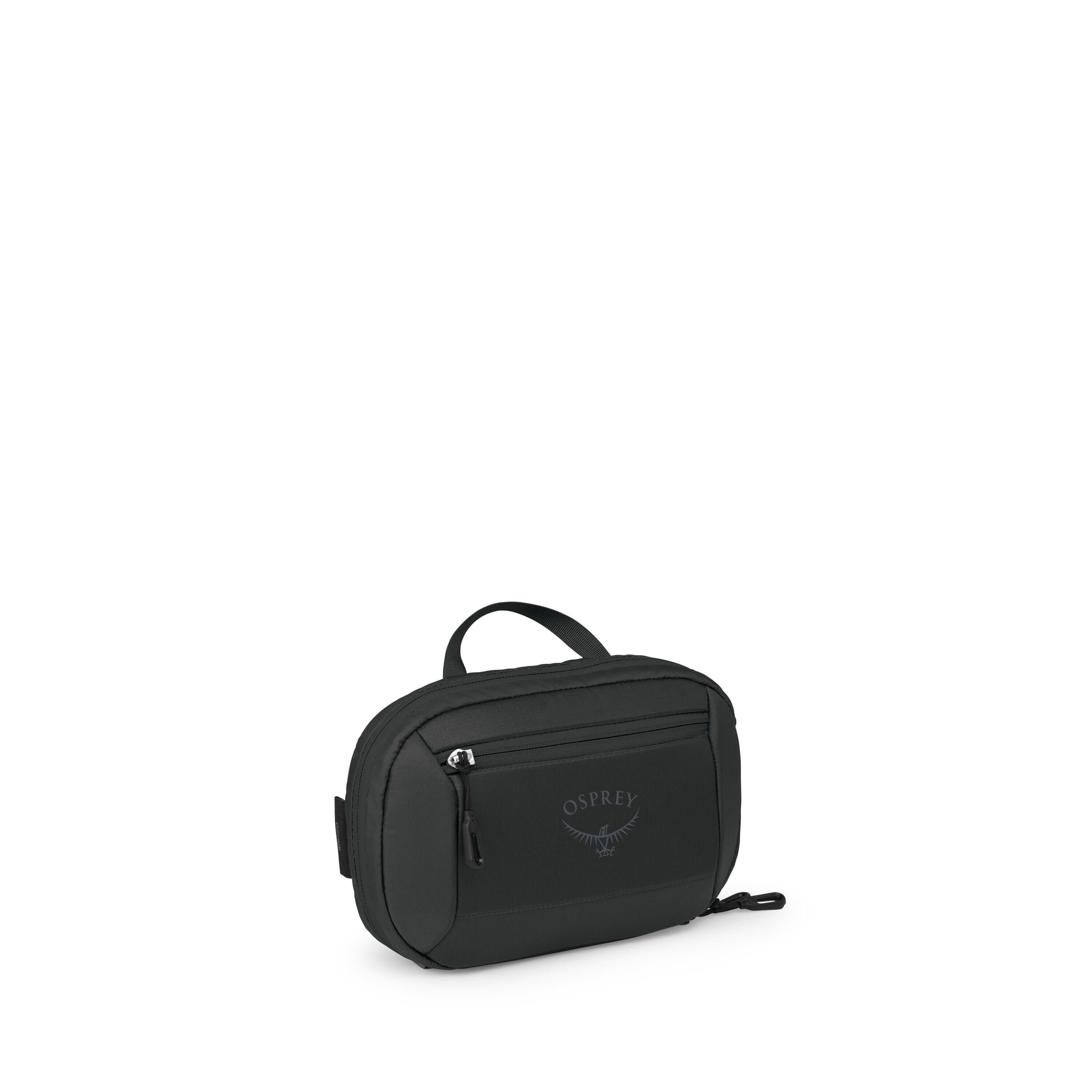The images show a compact black Osprey pouch or small travel bag. It has a rounded rectangular shape with a short top handle and a front zip pocket bearing the Osprey logo. A main zipper runs around the top and sides, and there's a small side attachment p