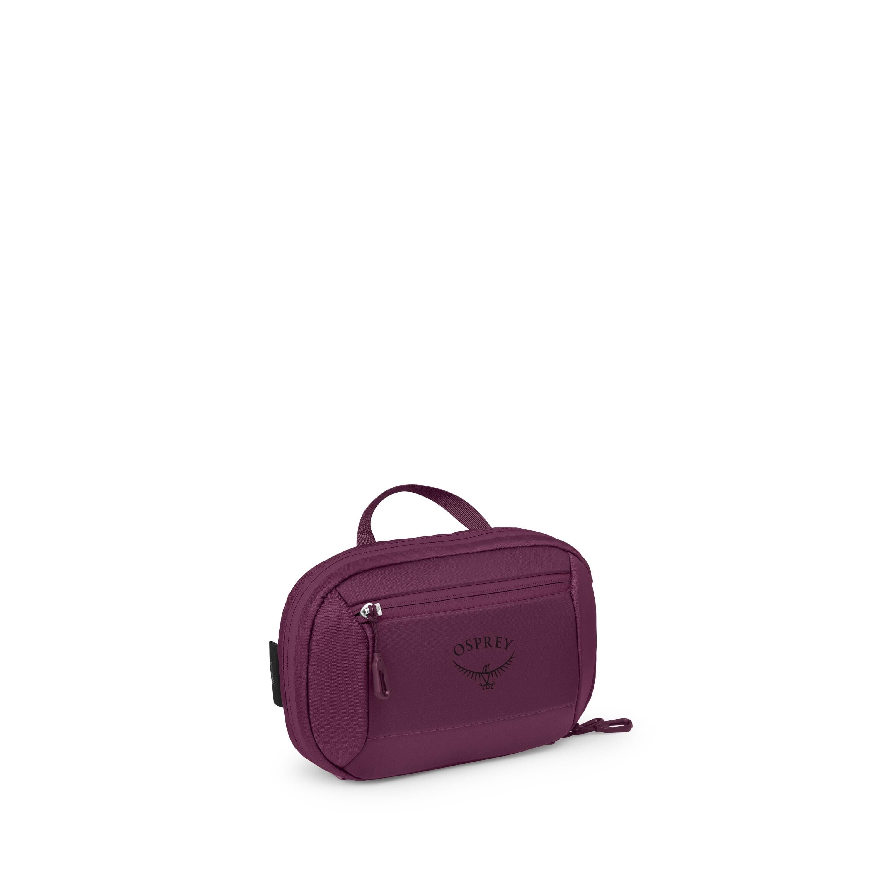 The images show a small Osprey travel pouch in a deep purple color. It has a compact, rectangular shape with rounded edges, a short top handle, and a front zip pocket featuring the Osprey logo. Additional views display the pouch from different angles, inc