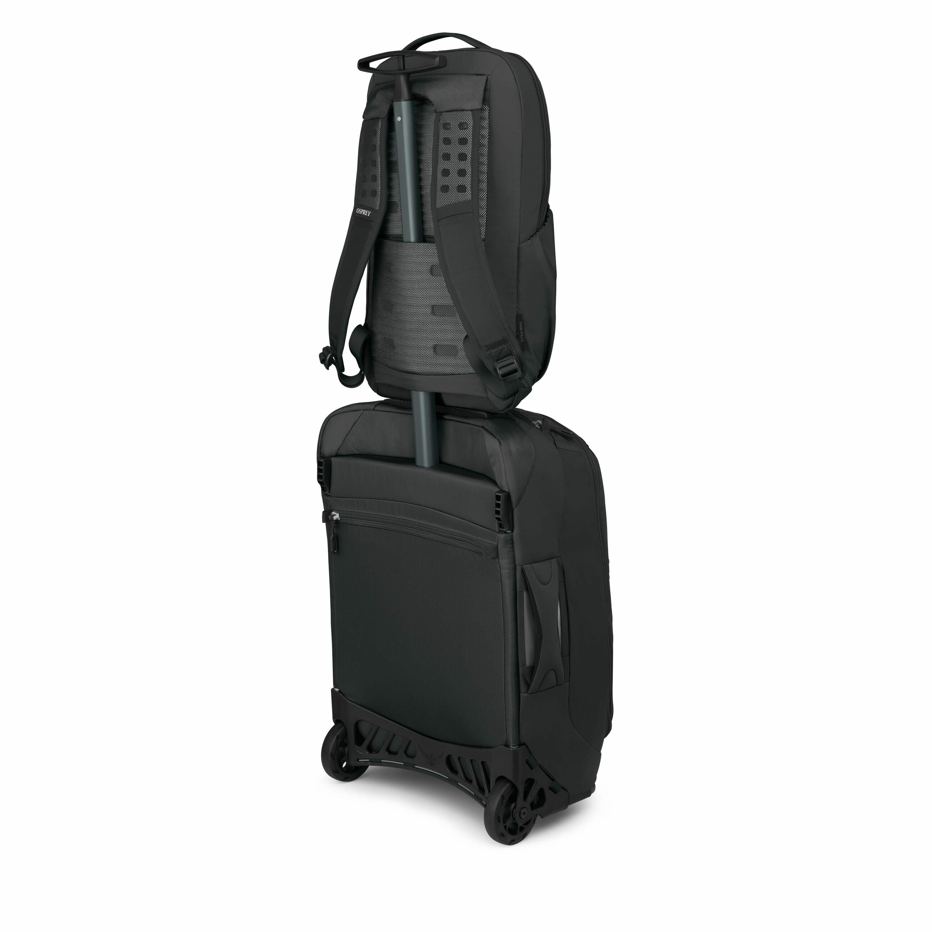 The image shows a black wheeled suitcase with a backpack attached to its extended handle, typical of travel luggage that offers dual functionality. The suitcase is designed with two large wheels for easy mobility, and a smooth, sleek exterior. The backpac