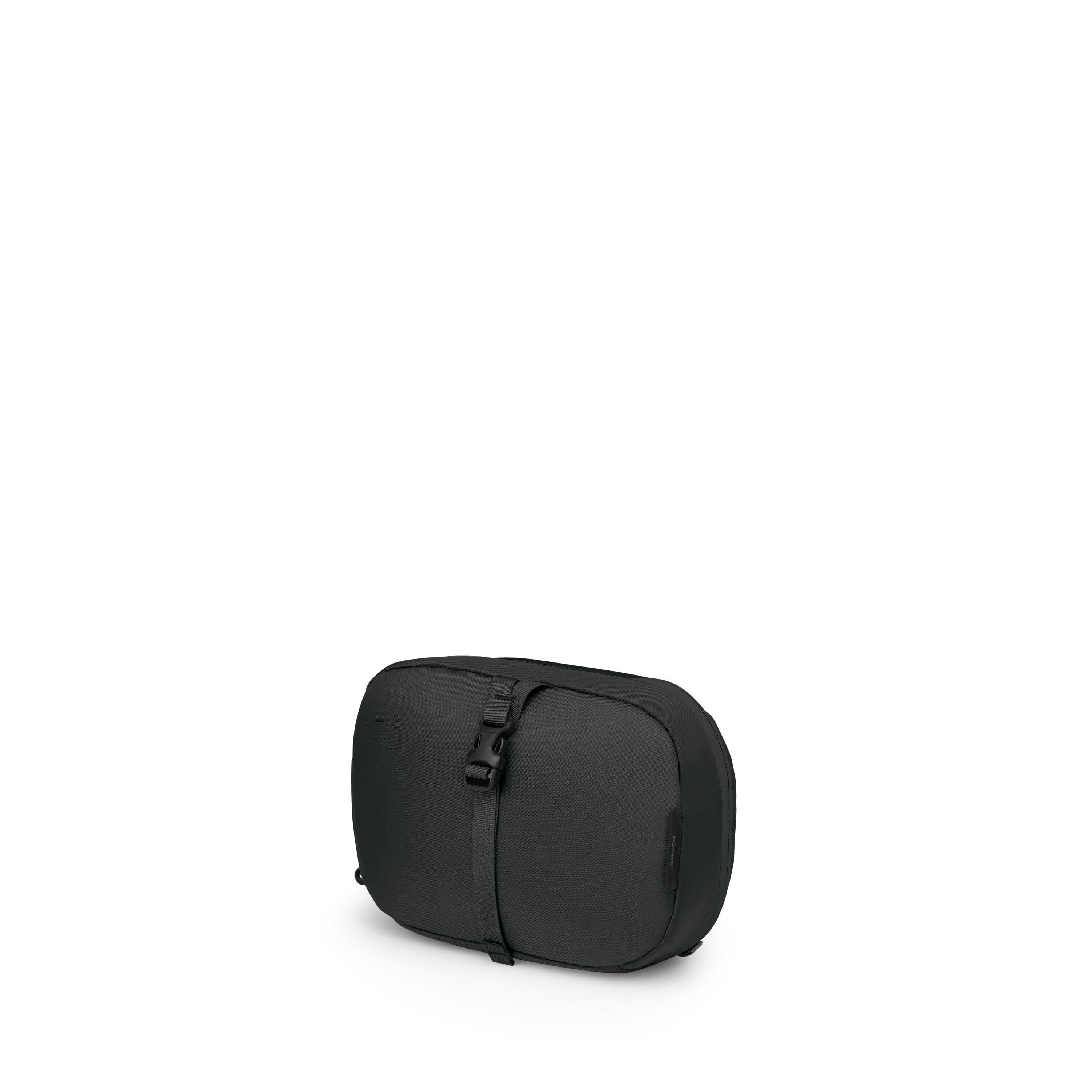 The images show a compact black pouch with a minimalist, rounded-rectangle shape. A vertical strap runs over the front and secures with a small buckle, giving it a clean, technical look. Some frames isolate components of the strap and buckle, and one vari