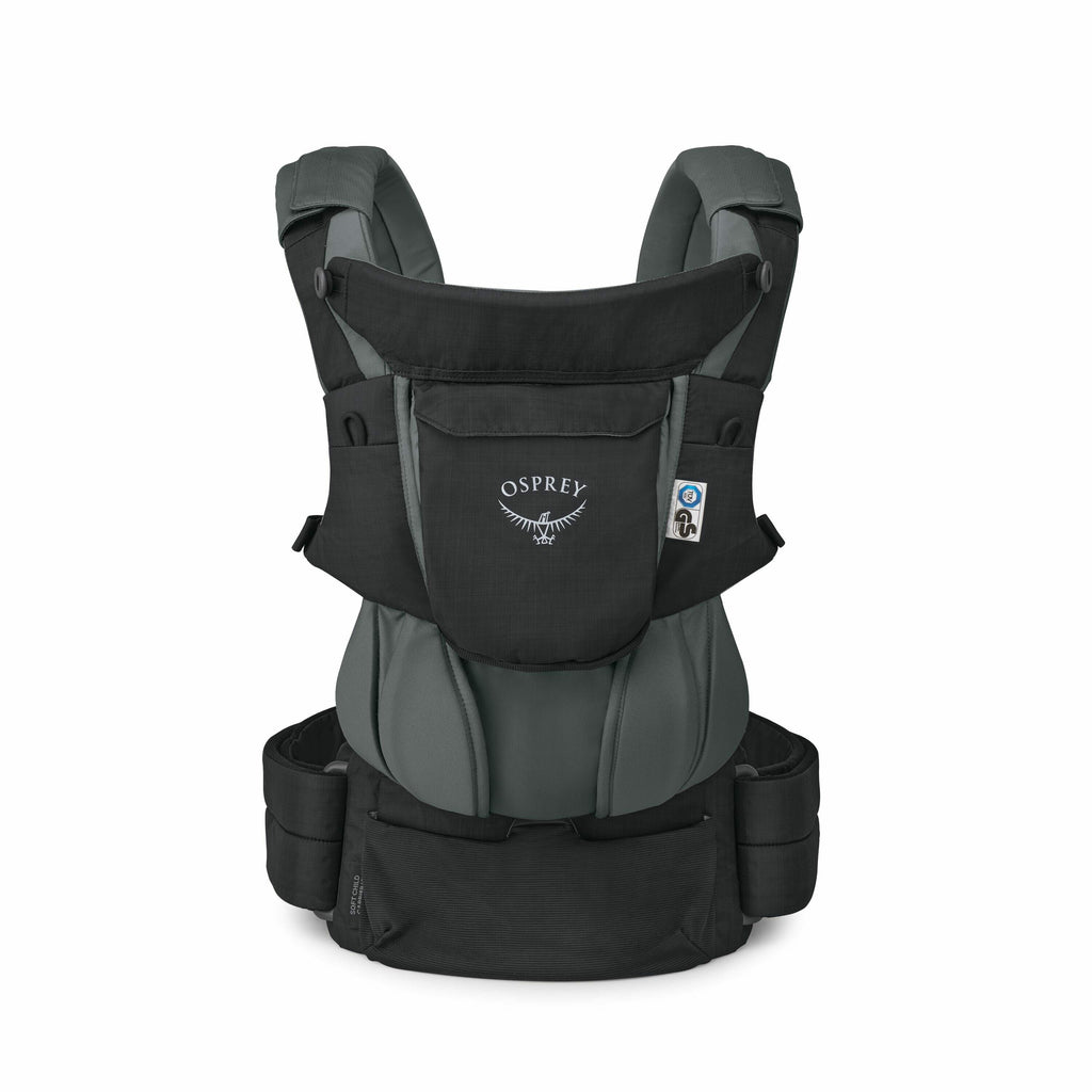 The images show a baby carrier designed by Osprey, featuring a sleek combination of black and dark green fabric. The carrier has a structured design with padded shoulder straps and a waistband for comfortable wearing. The Osprey logo, which includes the b