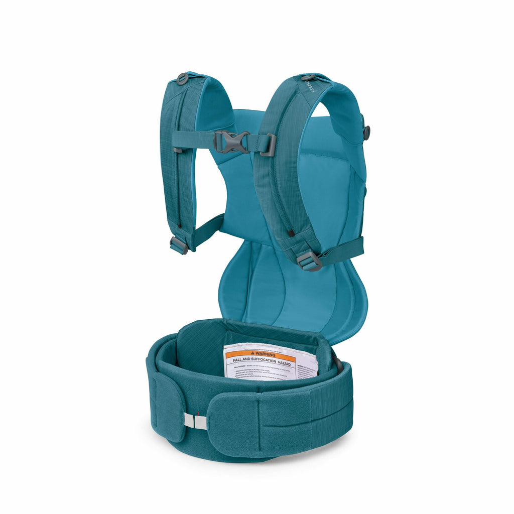 The images display various views of a teal-colored baby carrier. The first image shows the carrier with padded straps and a supportive waist belt that features a warning label, emphasizing safety information about fall and suffocation hazards. The second