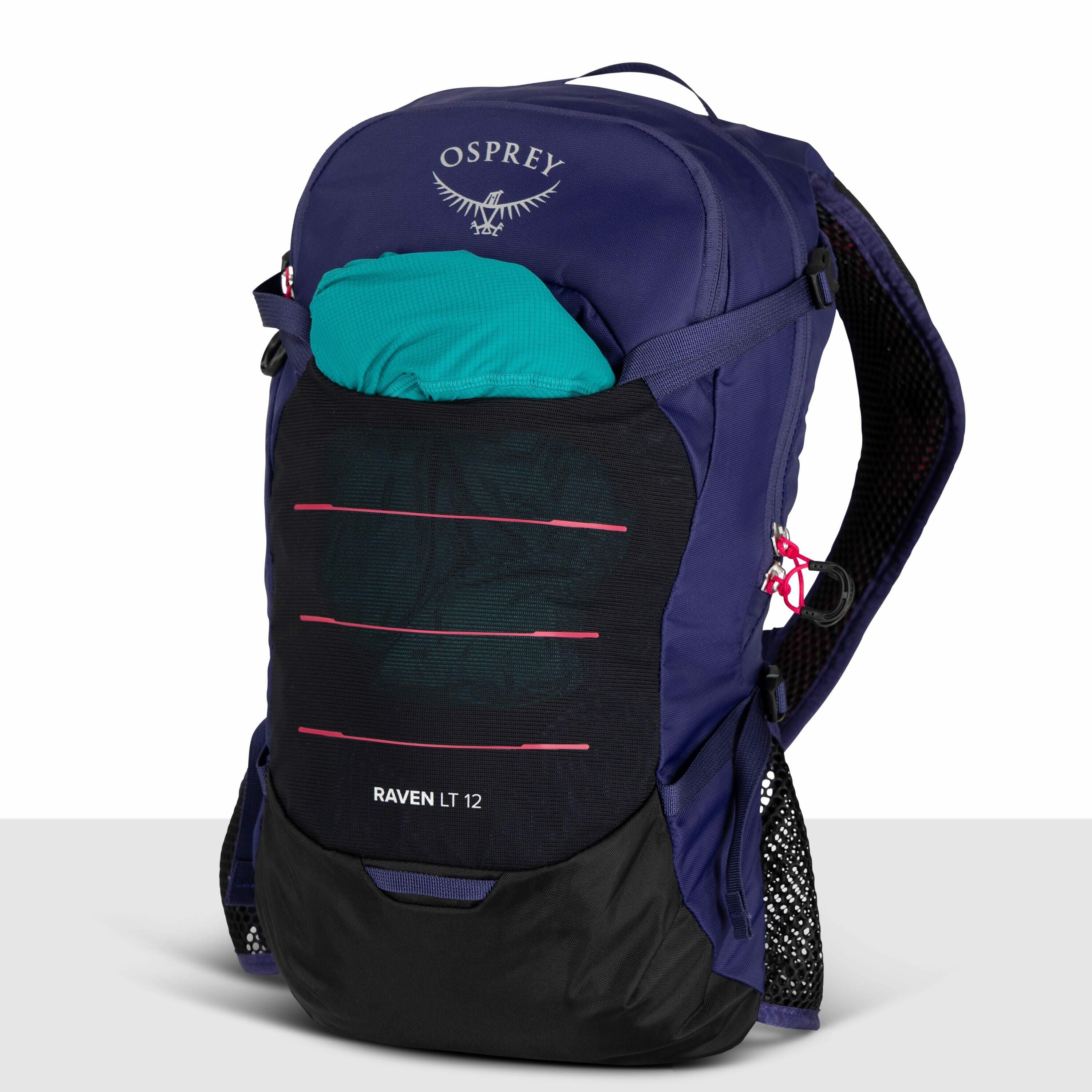 The image shows an Osprey Raven LT 12 backpack, which is primarily dark purple with black and pink accents. The Osprey logo is prominently displayed at the top of the backpack, featuring the word "OSPREY" and their signature bird design. A teal item is tu