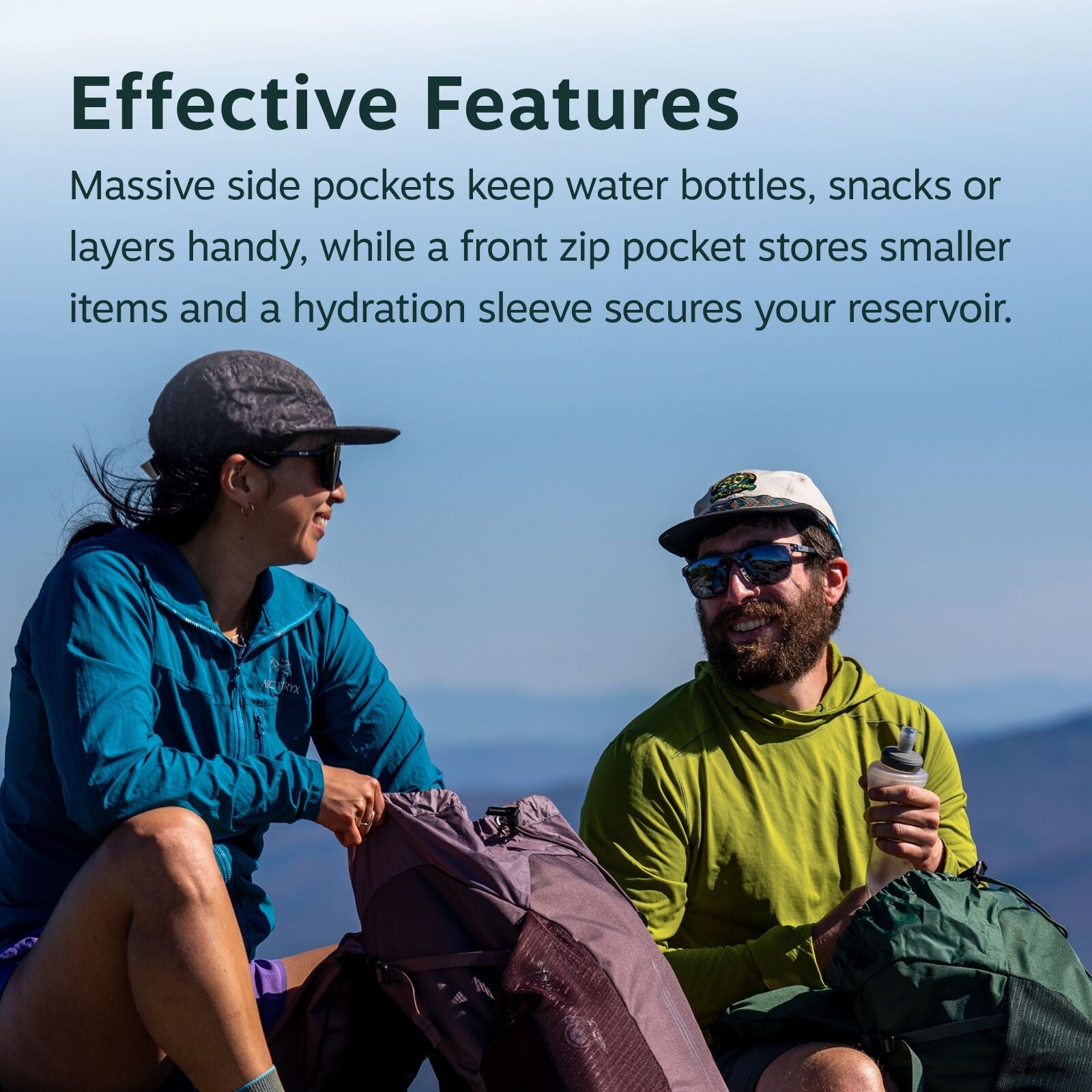 The image shows two individuals seated outdoors, presumably during a hiking or outdoor excursion. The person on the left is wearing a blue Arc'teryx jacket, a cap, and purple shorts, while holding a maroon backpack with various features as described in th